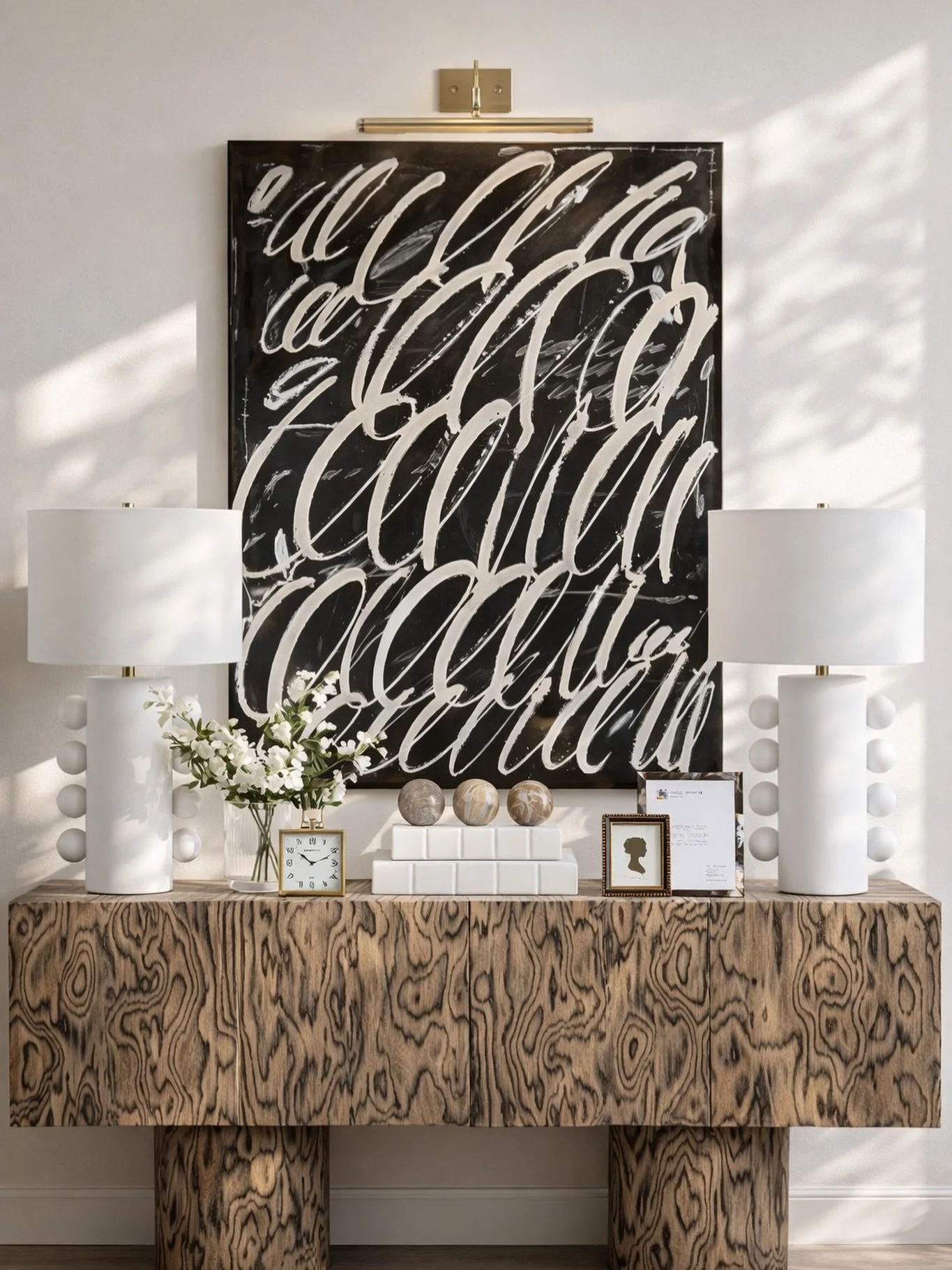 This is how you make an entryway feel instantly elevated. 🤍
Balanced, symmetrical, and anchored with statement art + sculptural lighting&mdash;every piece here works together to create a polished first impression. 

Comment SHOP below to receive a D