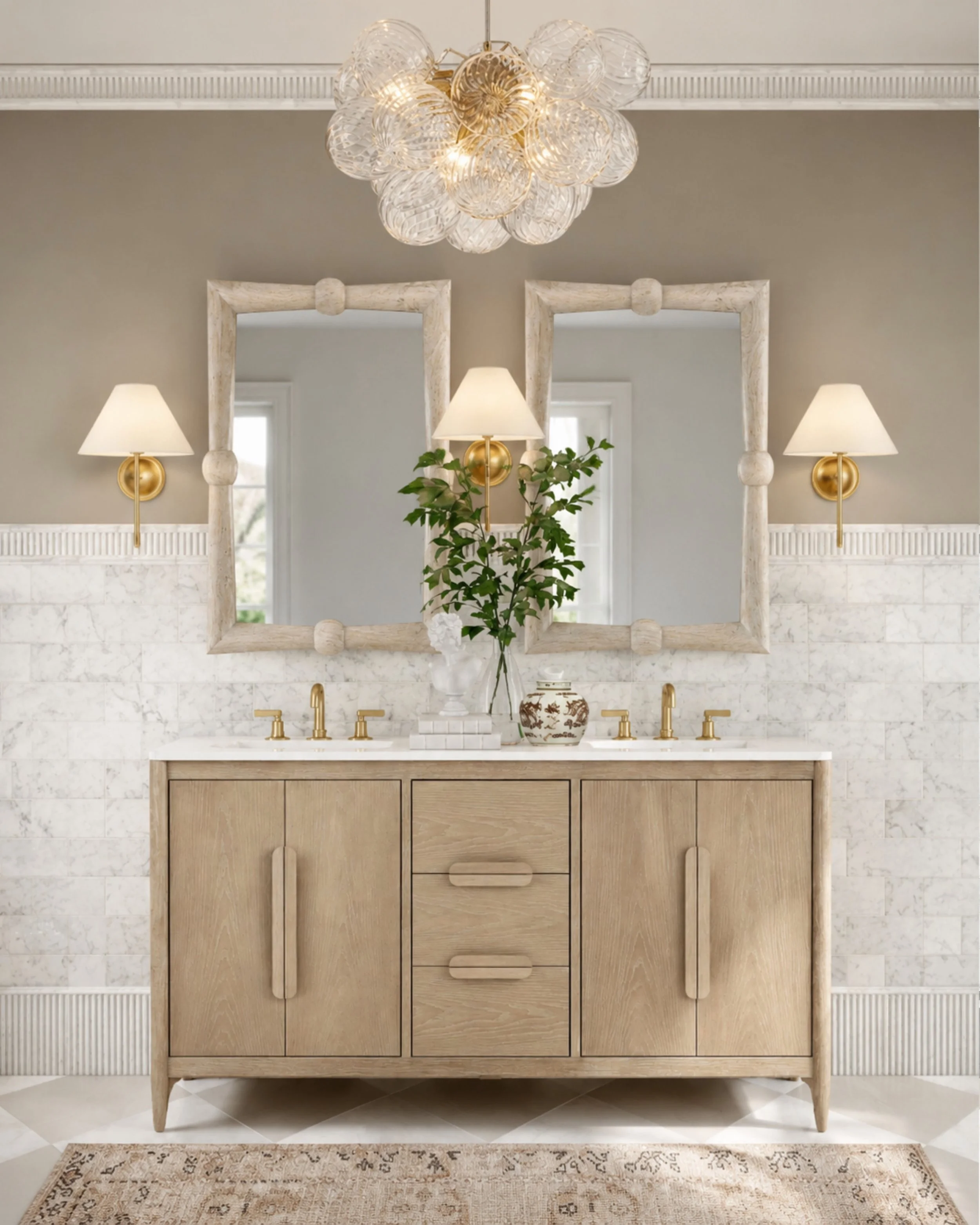This bathroom is exactly why I&rsquo;ll never get tired of warm neutrals and layered textures. ✨

The soft oak vanity, marble walls, aged brass accents, and sculptural lighting make the entire space feel calm, elevated, and timeless. I especially lov