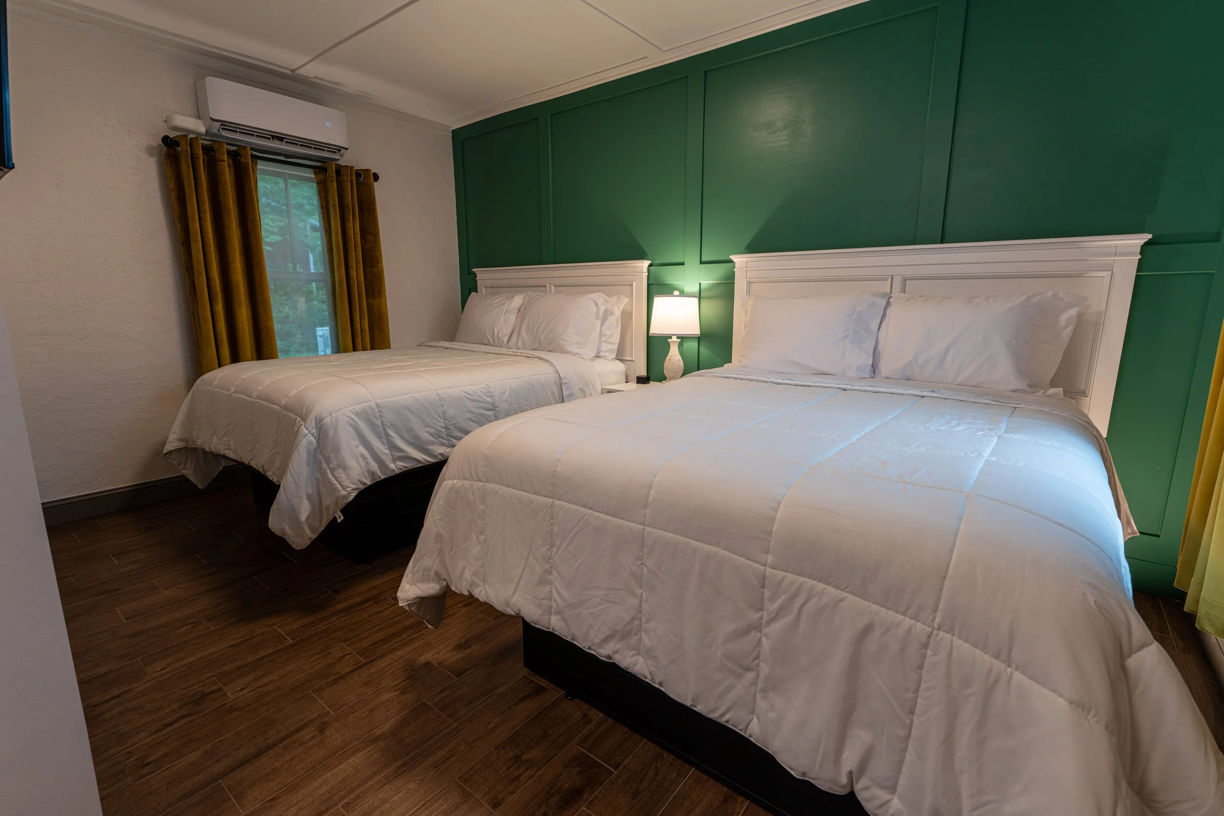 Room 2 double-queen bedroom at Shamrock Court, a restored historic Route 66 motor court in Sullivan, Missouri.