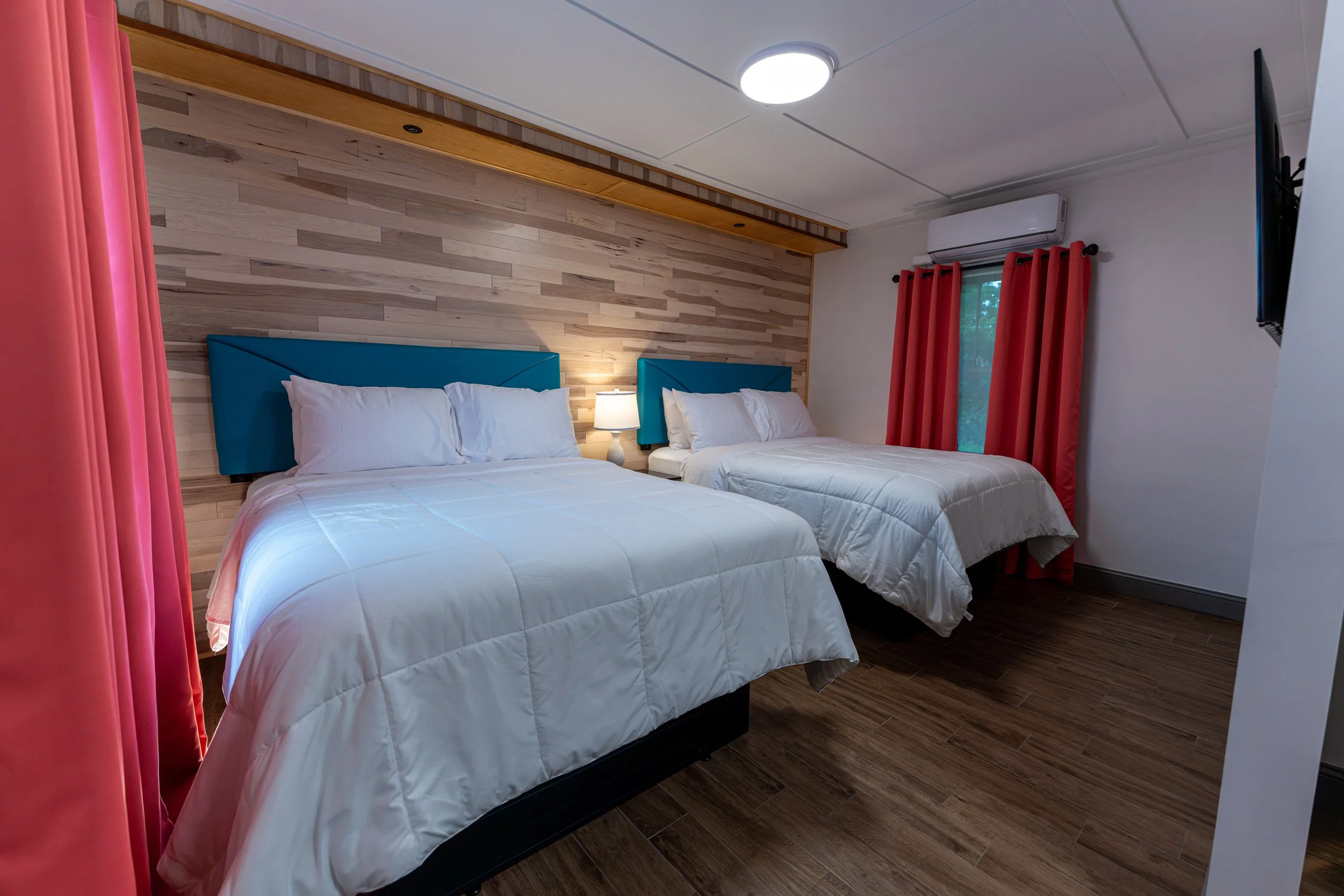 Room 3 double-queen bedroom at Shamrock Court, a restored historic Route 66 motel in Sullivan, Missouri.