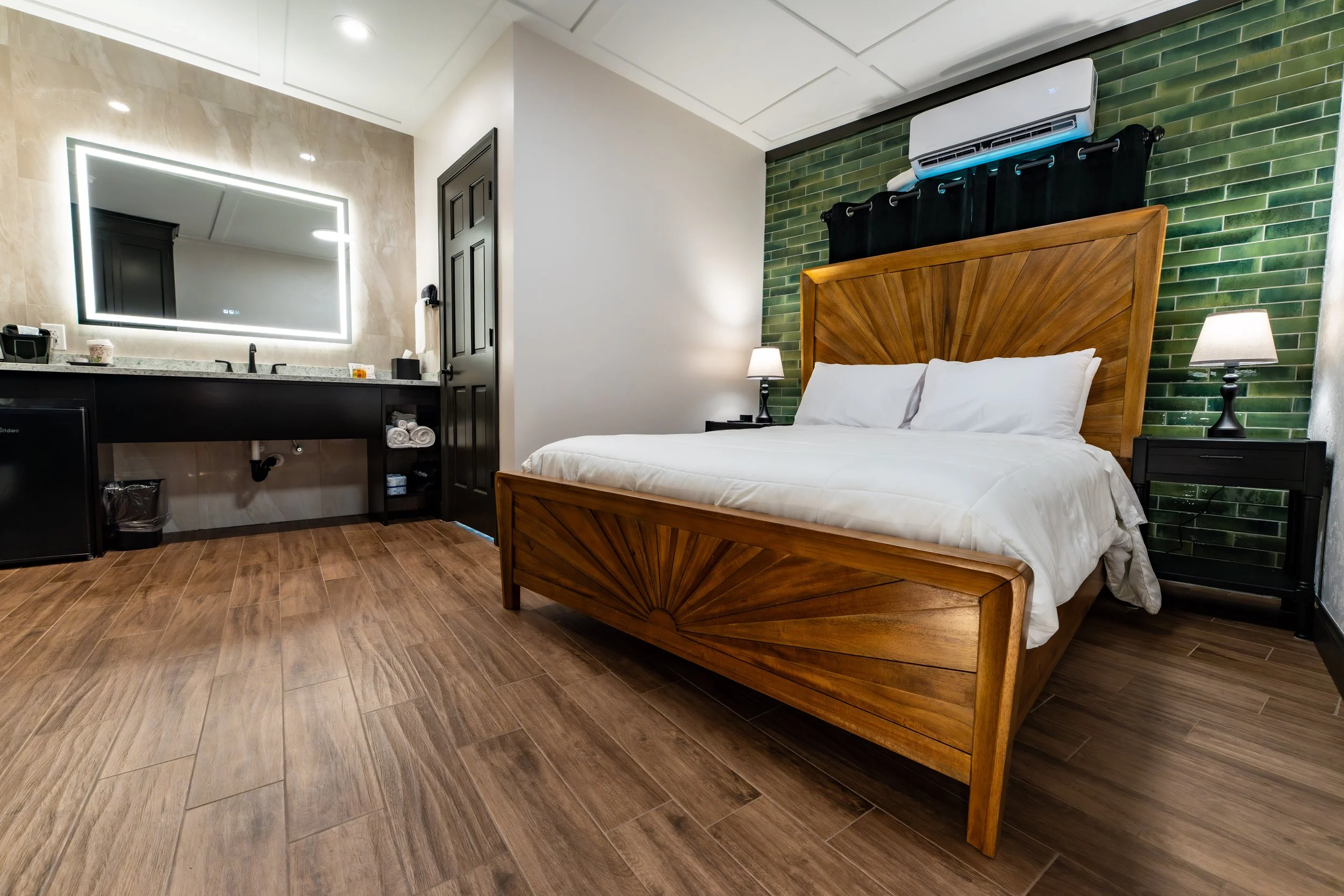 Room 6 queen bedroom at Shamrock Court, a restored historic Route 66 motel in Sullivan, Missouri.