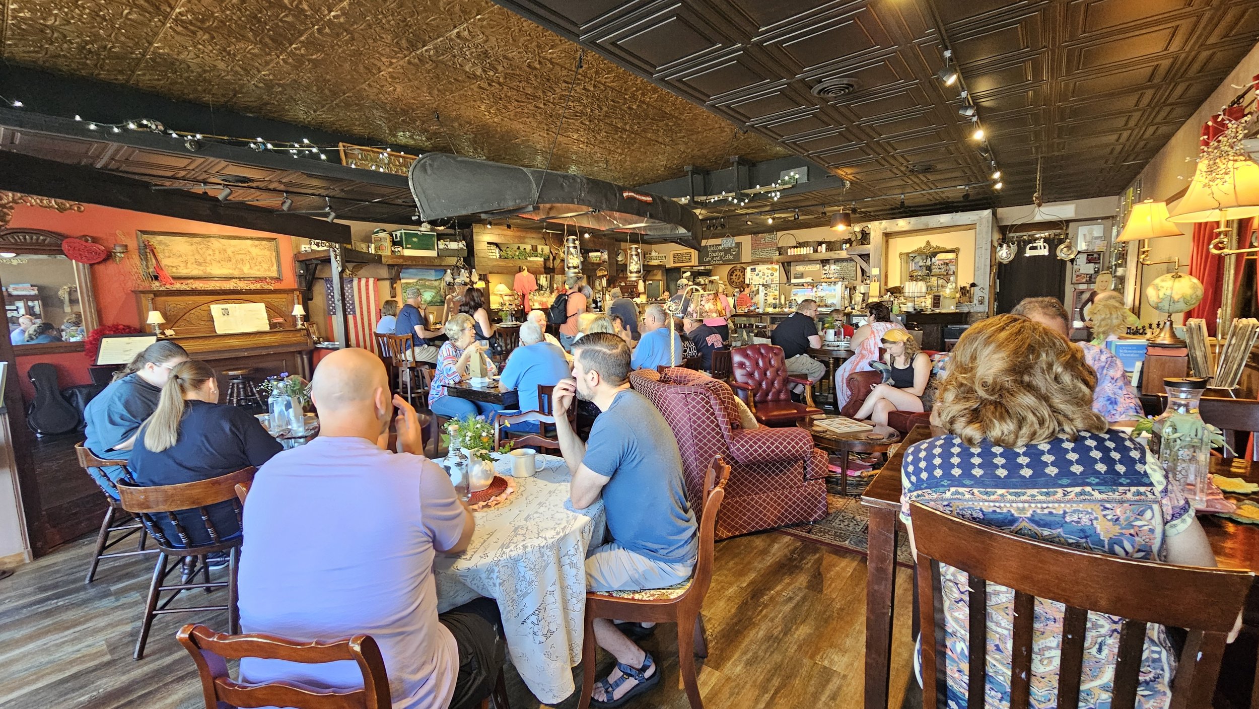 Guests enjoying the eclectic interior of Bourbon Cafe and Coffee Saloon near Sullivan, Missouri.