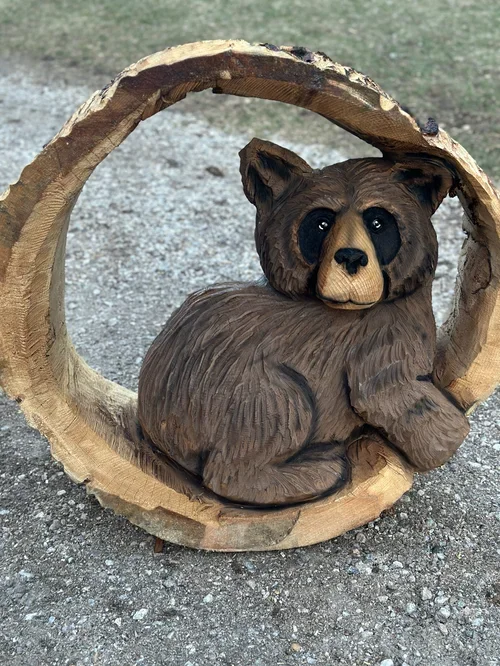 bear in a log.webp