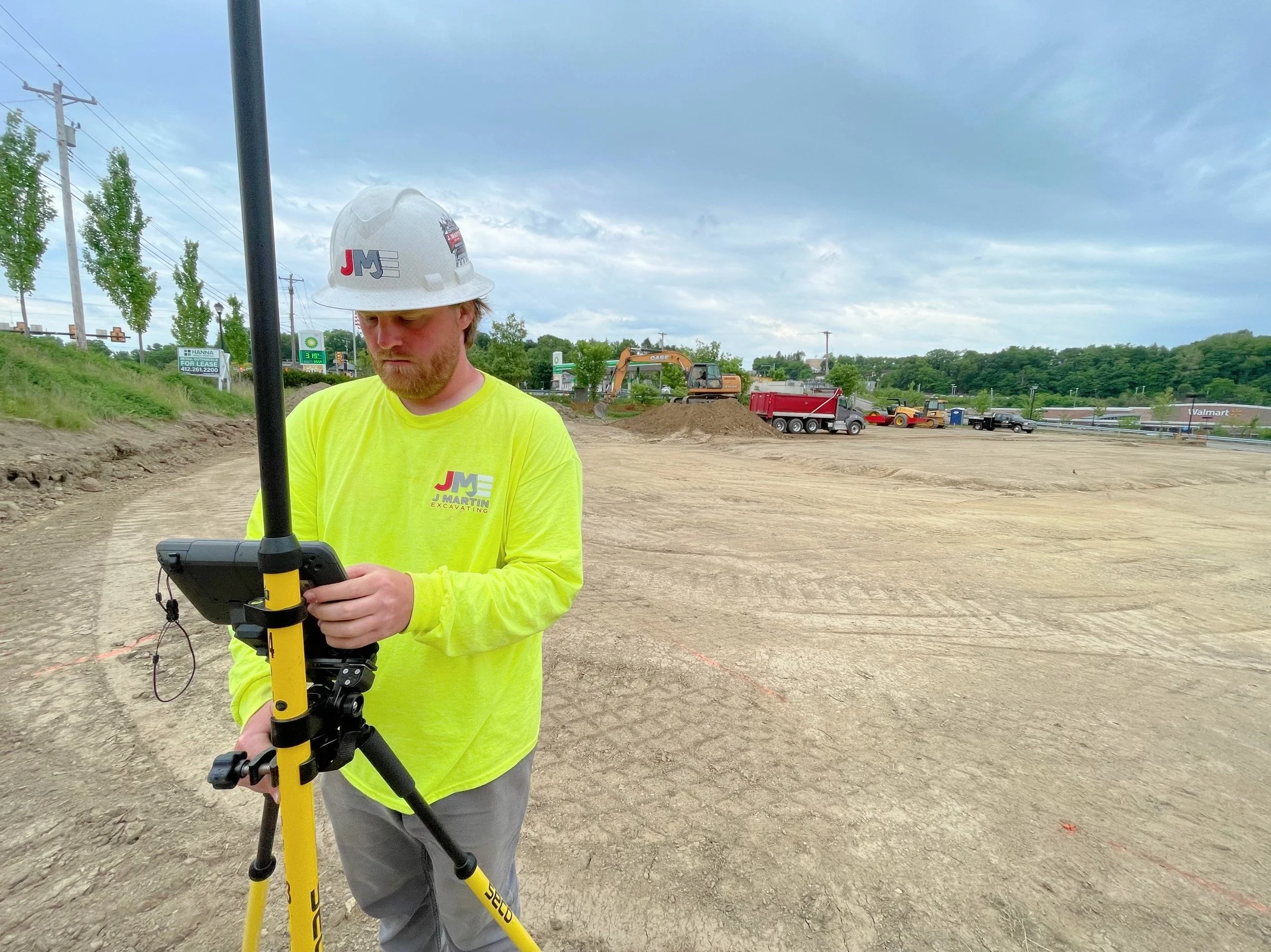 Construction worker, GPS laser, sitework, set-up, PPE