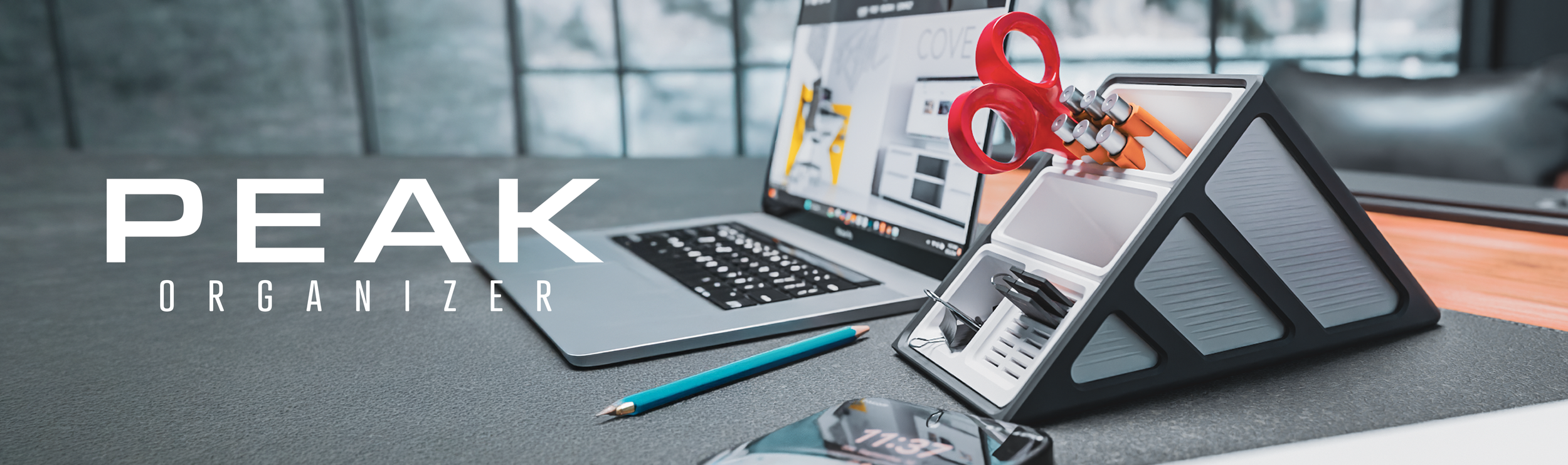 A desk organizer holding scissors, a pencil, paper clips, and other office supplies next to an open laptop, with a smartphone displaying the time 17:37, in front of a large window. Overlaid text reads 'PEAK ORGANIZER'.