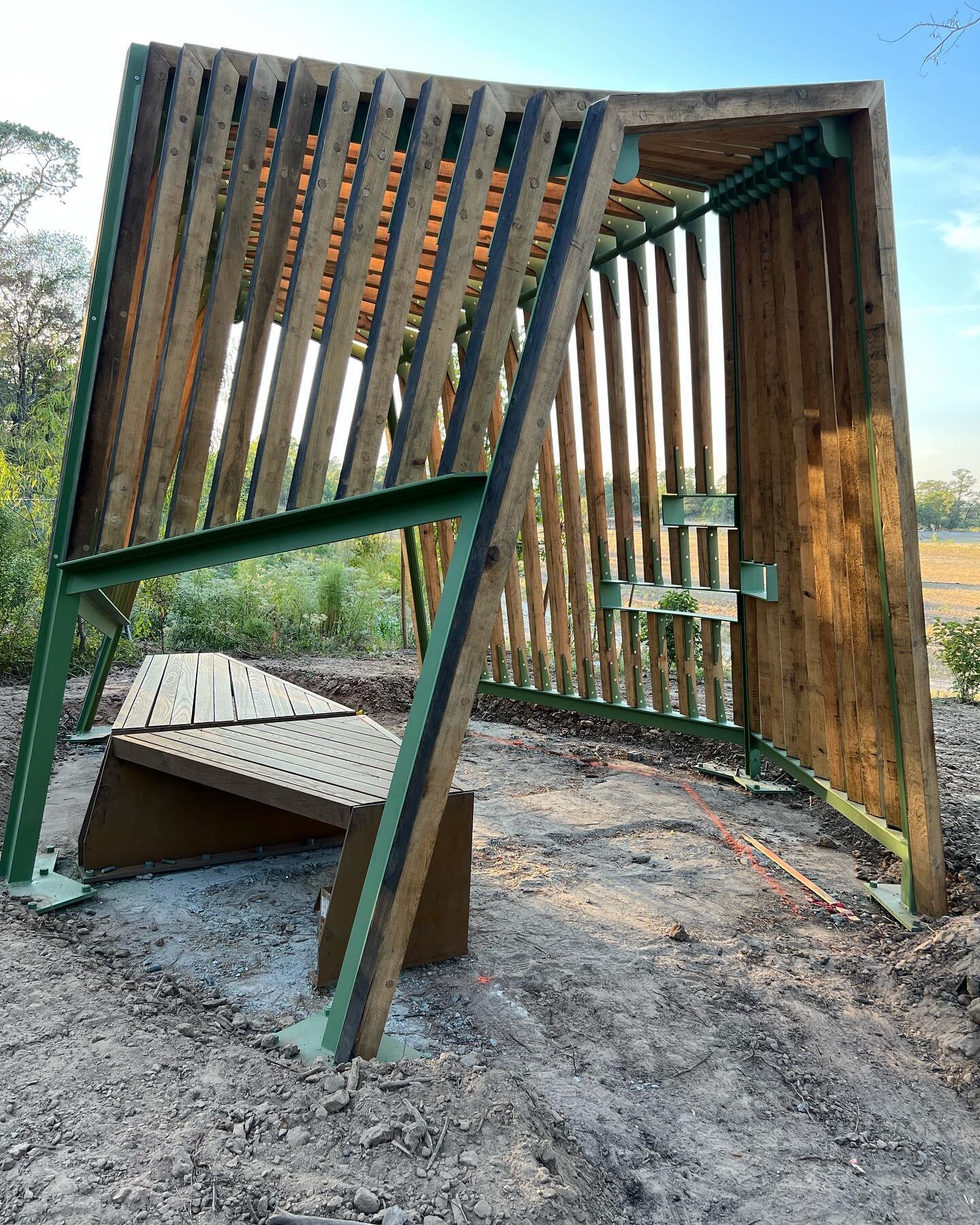 This beautifully formed birding shelter is ideally suited to its placement above the vast newly-grown meadow south of the new Land Bridge. Occupants are able to view into the meadow while camouflaged from the wildlife. It seems like the merest amount