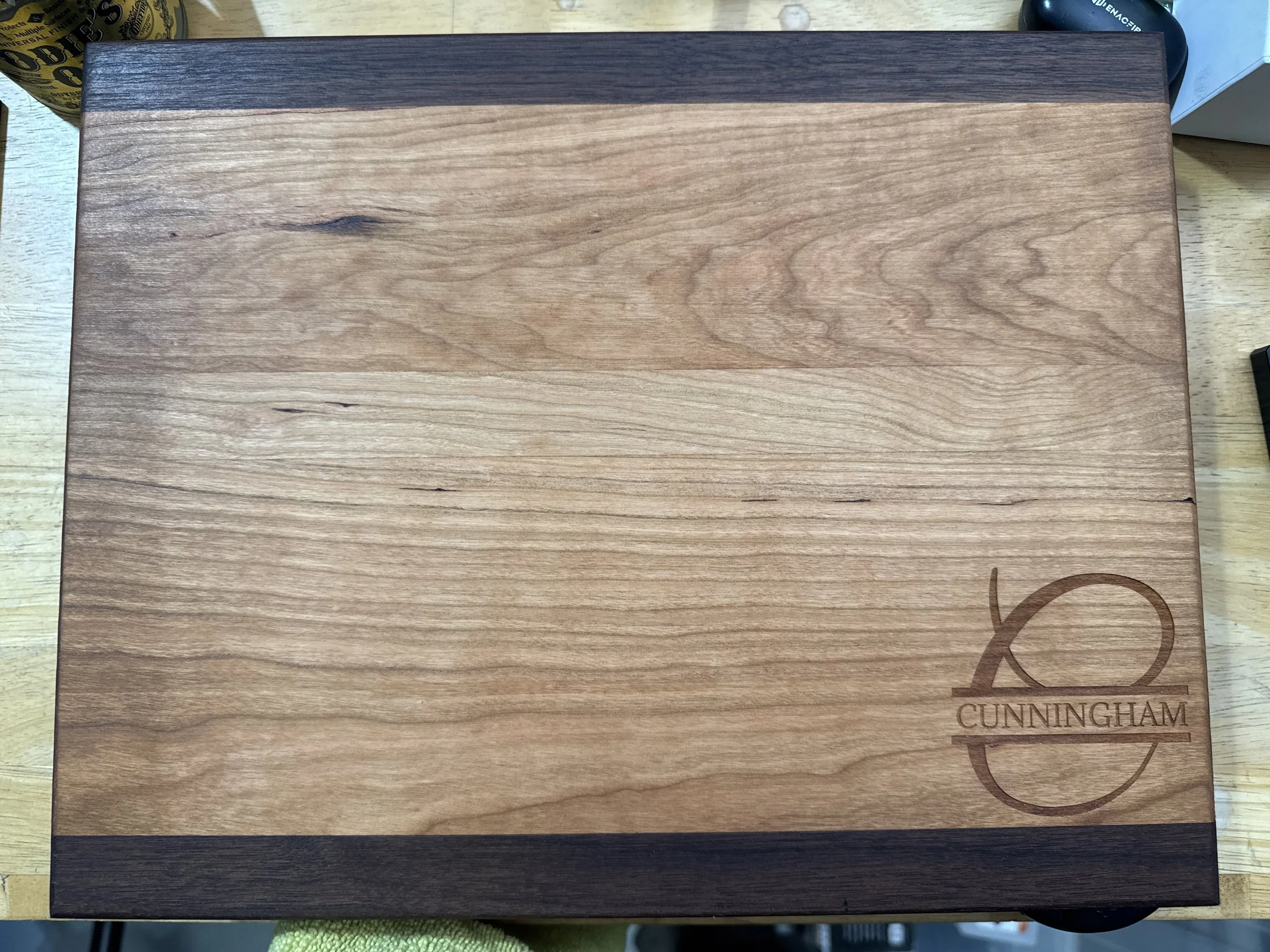 Wooden box with a Cunninghams logo engraved in the bottom right corner.
