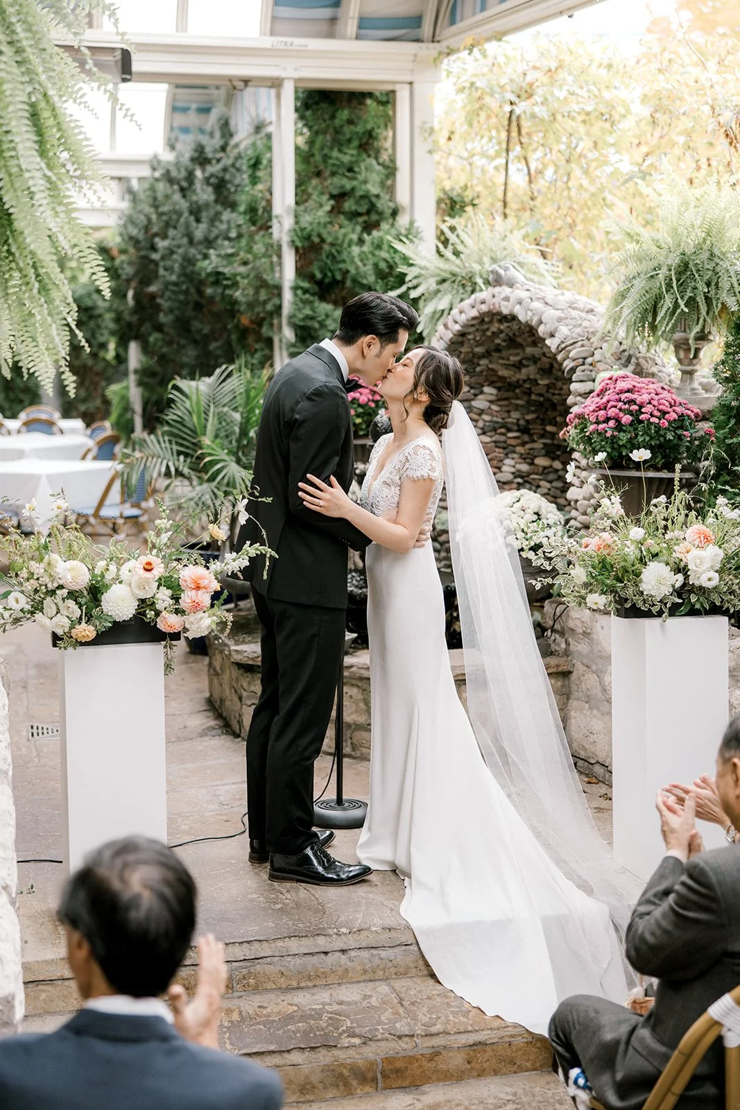 Elegant floral centerpiece with blush peonies and soft greenery, created by a wedding florist in Pickering.