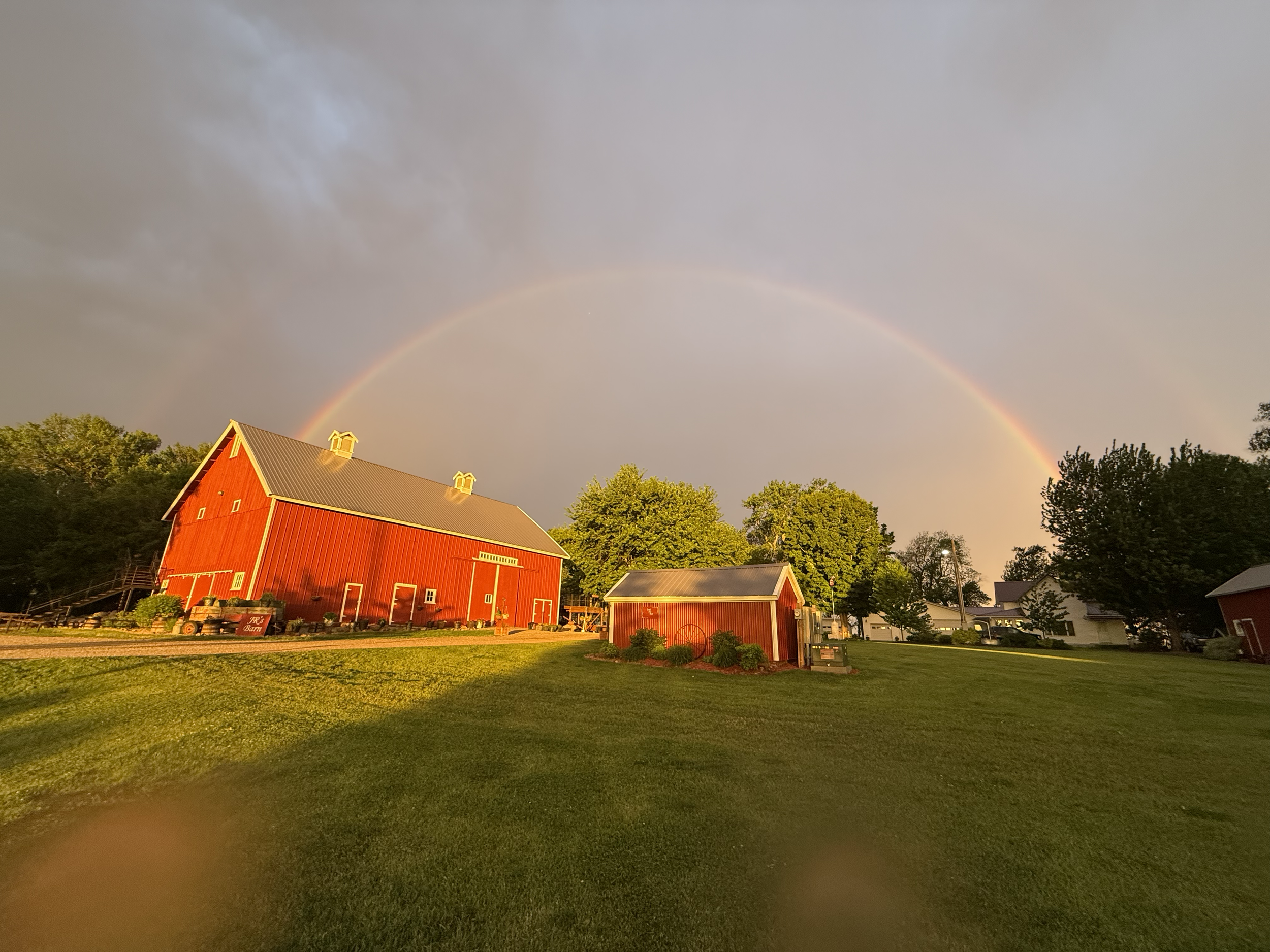 The Nations Glory Barn under a rainbow