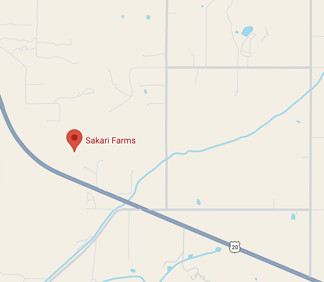 Map showing the location of Sakari Farms along a highway, with nearby roads, water bodies, and fields.