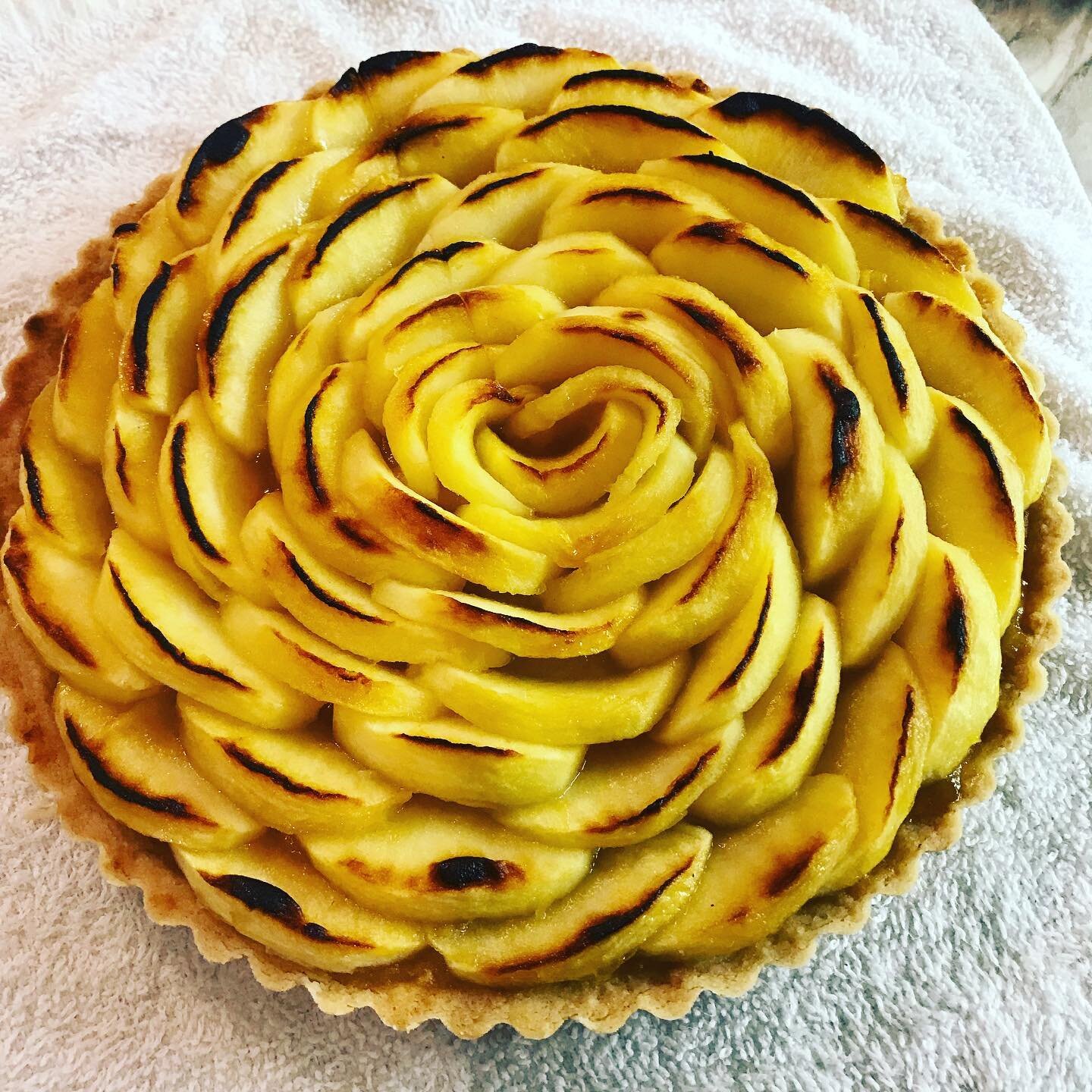 French Apple Tart...10 apples in this little guy!! Served with honey and green tea sorbet. #yegcatering #yegfood #apples #fall #to @cooksillustrated @testkitchen
