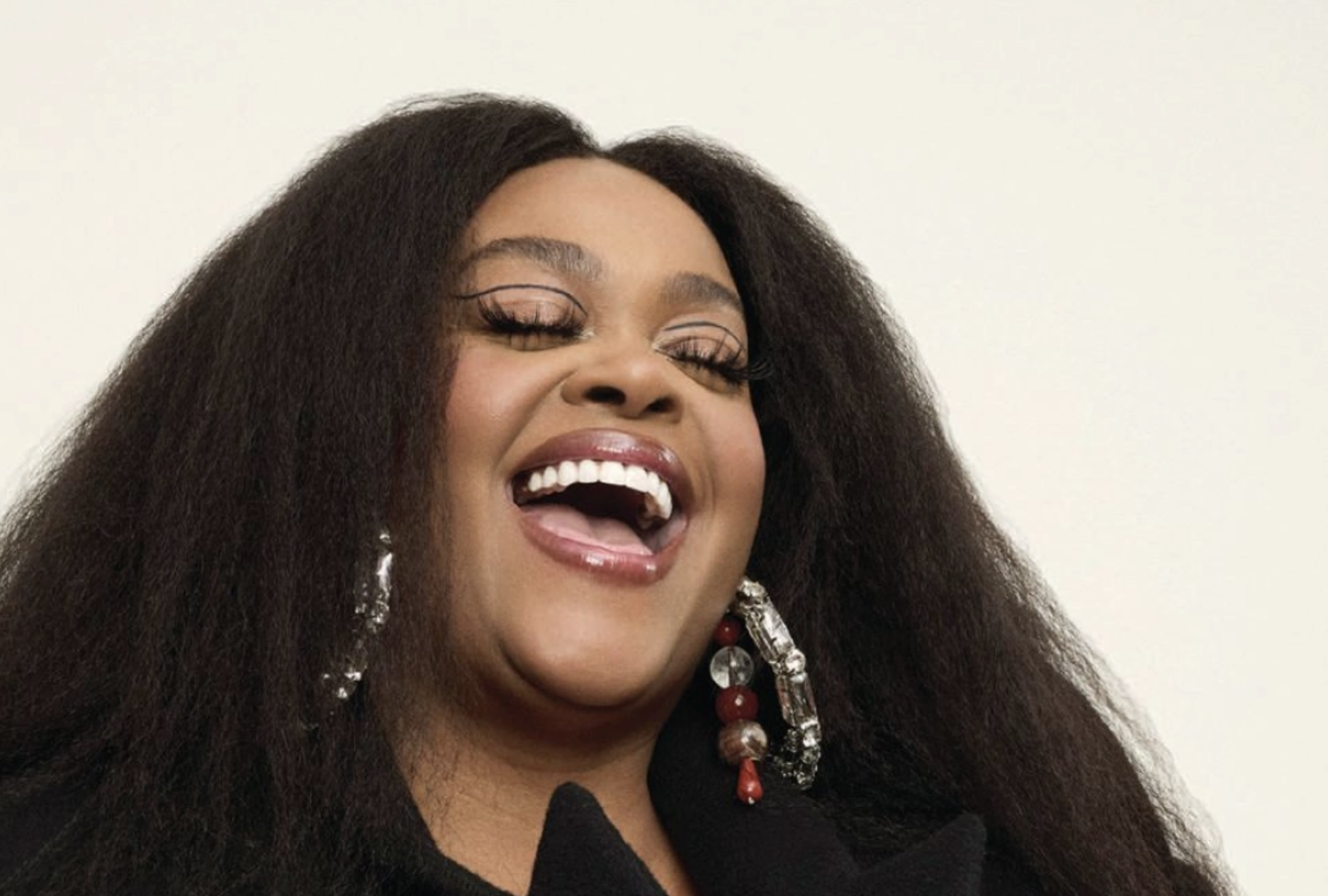 Close up of Jill Scott singing