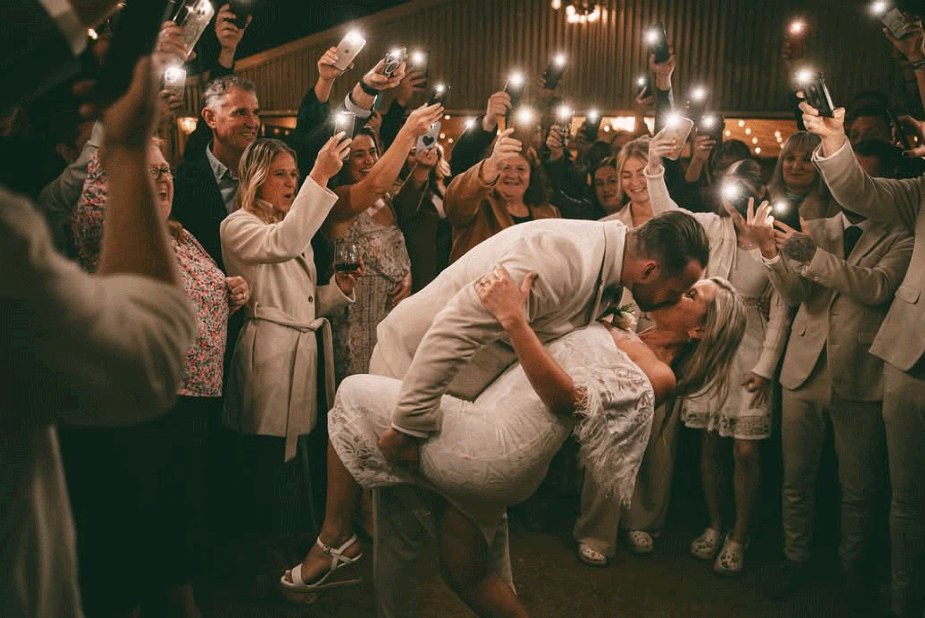 Newlyweds celebrating with wedding guests on the dance floor