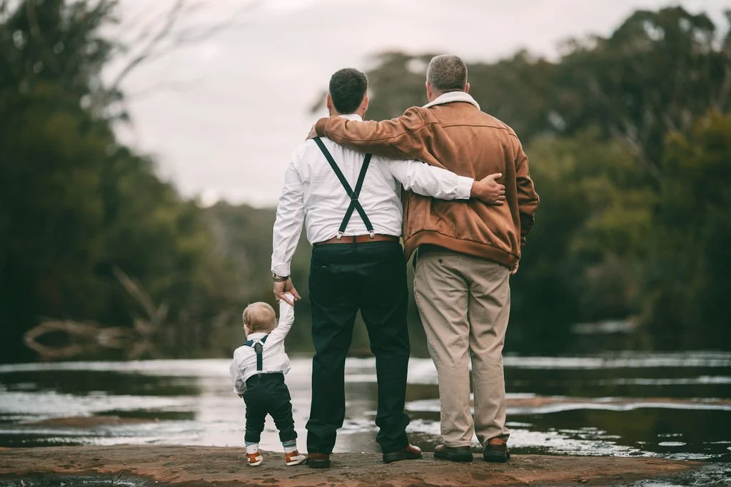 Juan-Ruan walking with a family member and young child during the wedding day