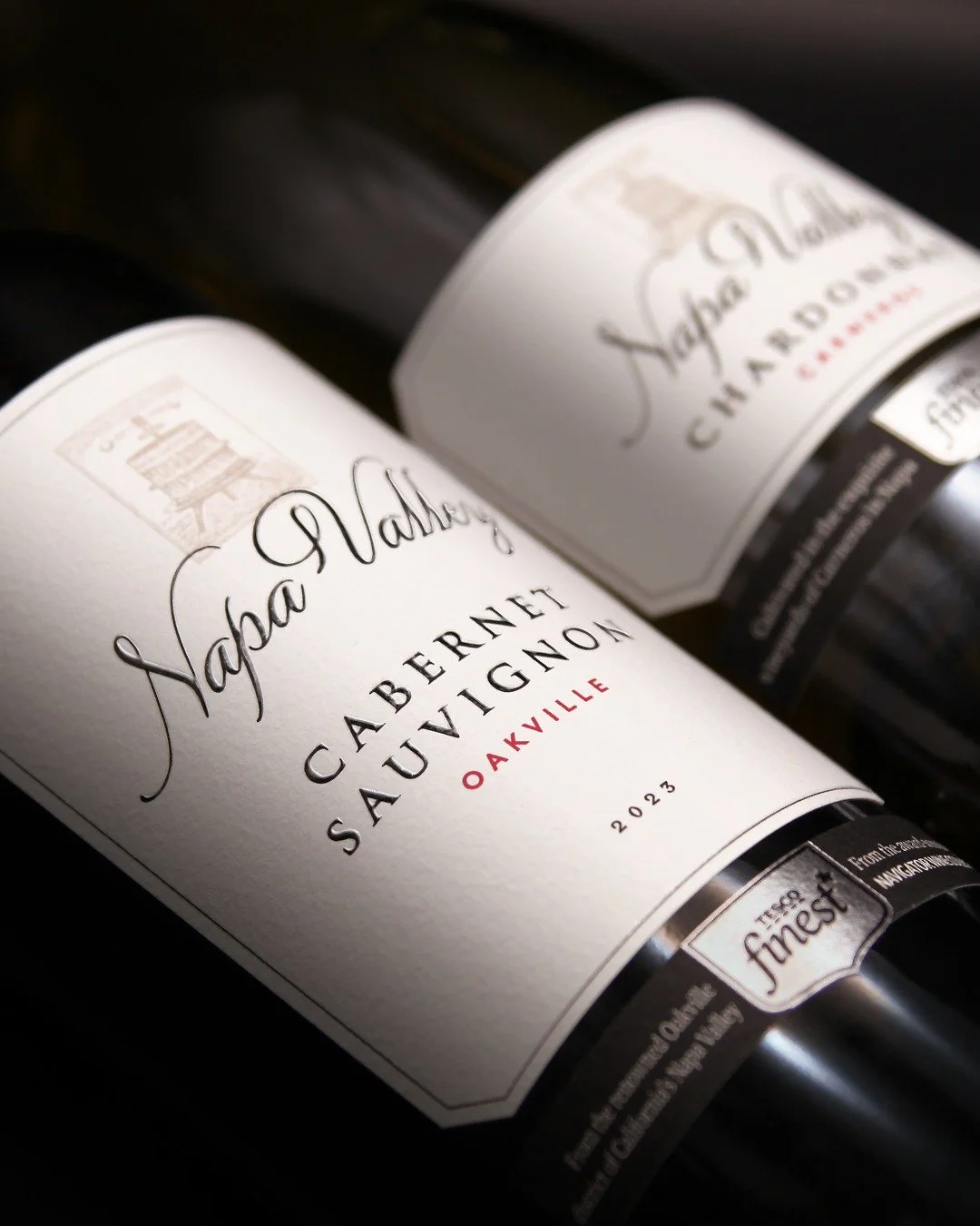 At the top end of Tesco&rsquo;s Finest range is a new pair of wines from the Napa Valley. Elegant typography on sumptuous uncoated paper embossing matches the quality of the wines, and a traditional wine press motif adds authenticity.