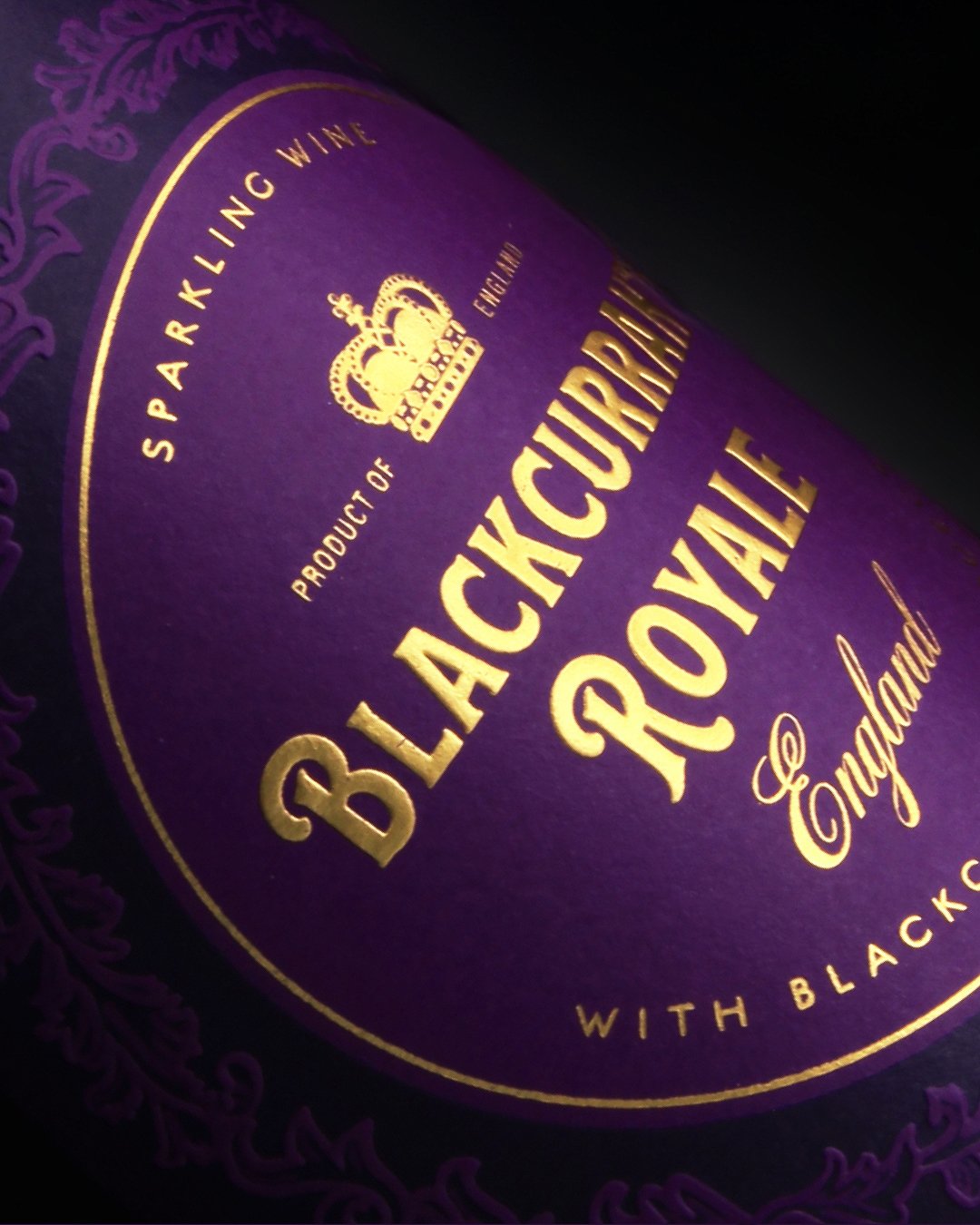 Blended with English sparkling wine, M&amp;S Blackcurrant Royale demanded a design that celebrated provenance and craftsmanship. Through the use of rich gold foil, embossed pattern detailing, and classic Victoriana typography, we created a distinctiv