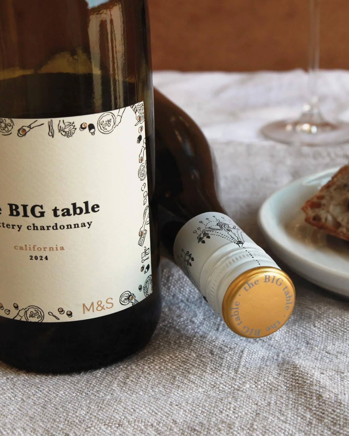 The success of The Big Table lies as much in the materials as the design. A premium uncoated paper stock, chosen to evoke the texture of a linen tablecloth, brings warmth and tactility to the label while complementing the illustrations.
&nbsp;
Gold f