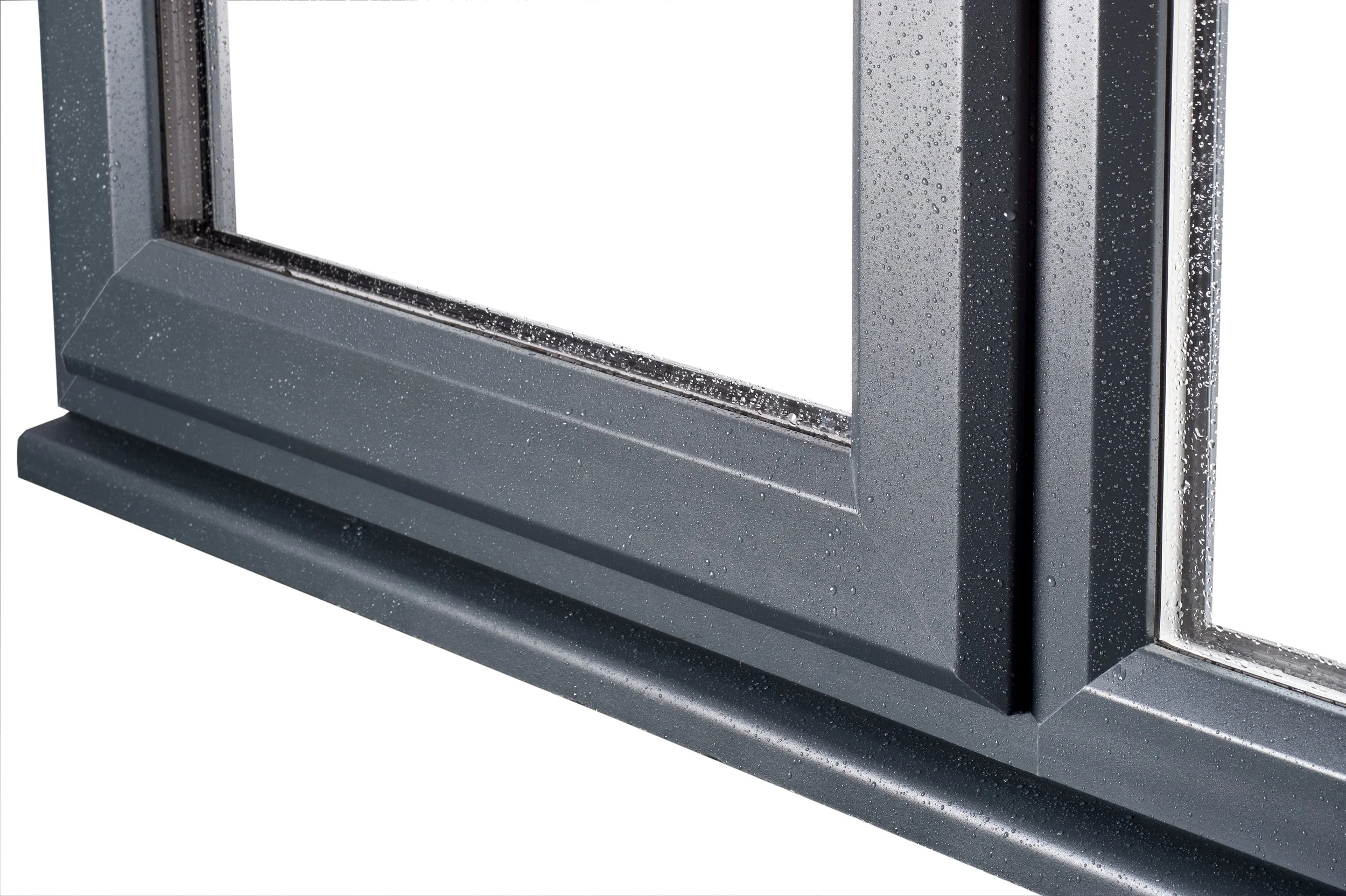 Close-up of a gray aluminum window frame with rain droplets on the glass and frame.