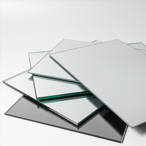 Stacked mirror sheets with reflective and tinted surfaces on a white background.