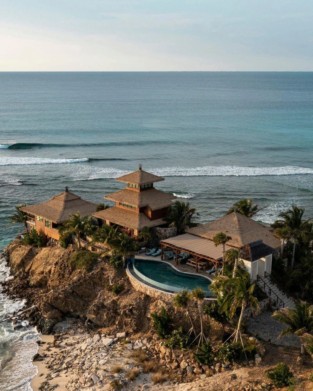Not a hotel. Not a resort. Richard Branson&rsquo;s vision of paradise.

You arrive by boat just as the cliffs begin to glow &mdash; Balinese-style villas tucked into the hillside, lanterns flickering to life, lemurs watching from the trees. This is a