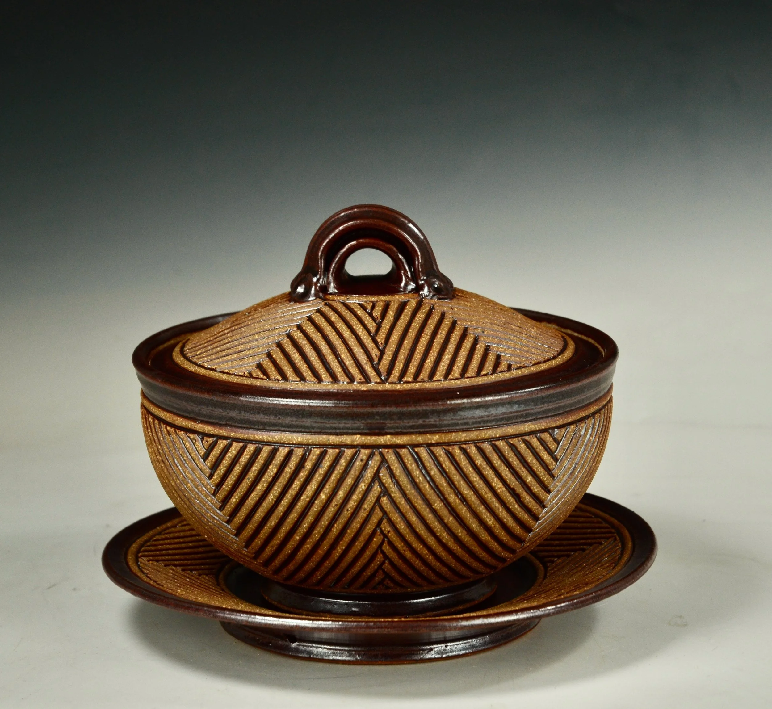 5. Serving Set #19.   Carved Stoneware.   8" h. x 10" did.