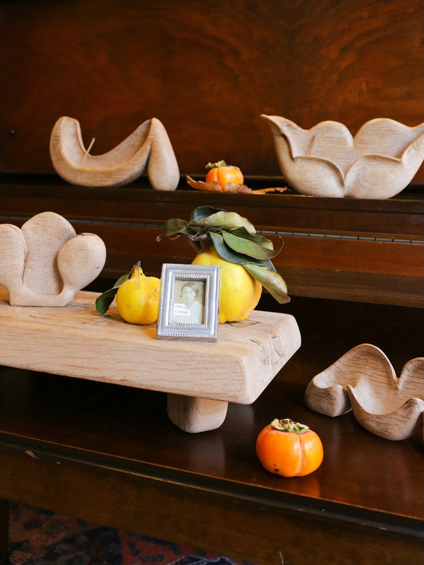 One photo. Many sweet connections. Incense holders and altar by @nial.nutter 〰️ quince from @in.fluence002 〰️ persimmon from @okappahouseware 〰️ shop piano from @lukewyland 〰️ photo by @adamatusiewicz 〰️ and my sweet Baba, Fumi, at the center. Our co