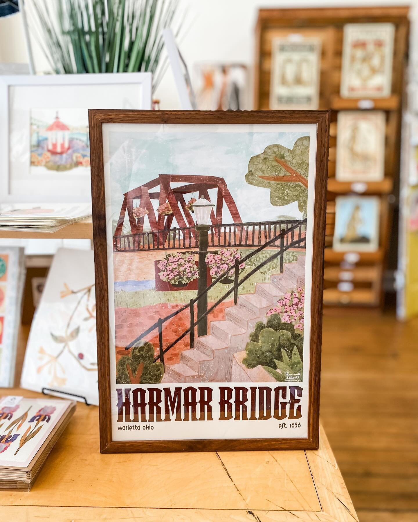 You guys - @hannahceleste.art brought us these beautiful Harmar Bridge prints yesterday! 😍😍 Created with her paper cut and handpainted technique, these prints are 11x17. The best news? 25% of each sale will be donated to the @historicharmarbridgeco