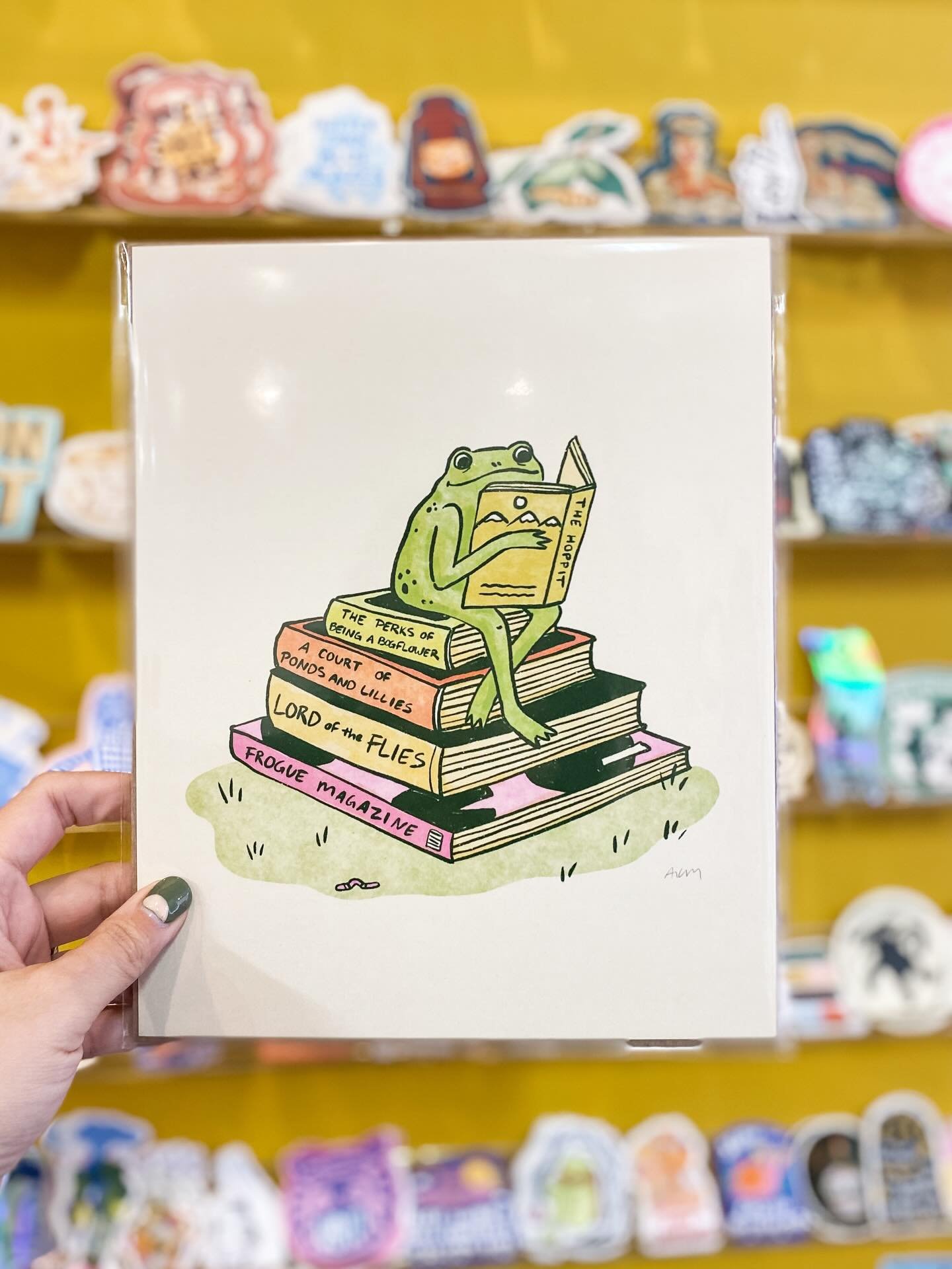 Cozy new prints and stickers are in from @allison.mckeen! 🐸📚 Open 10-6!