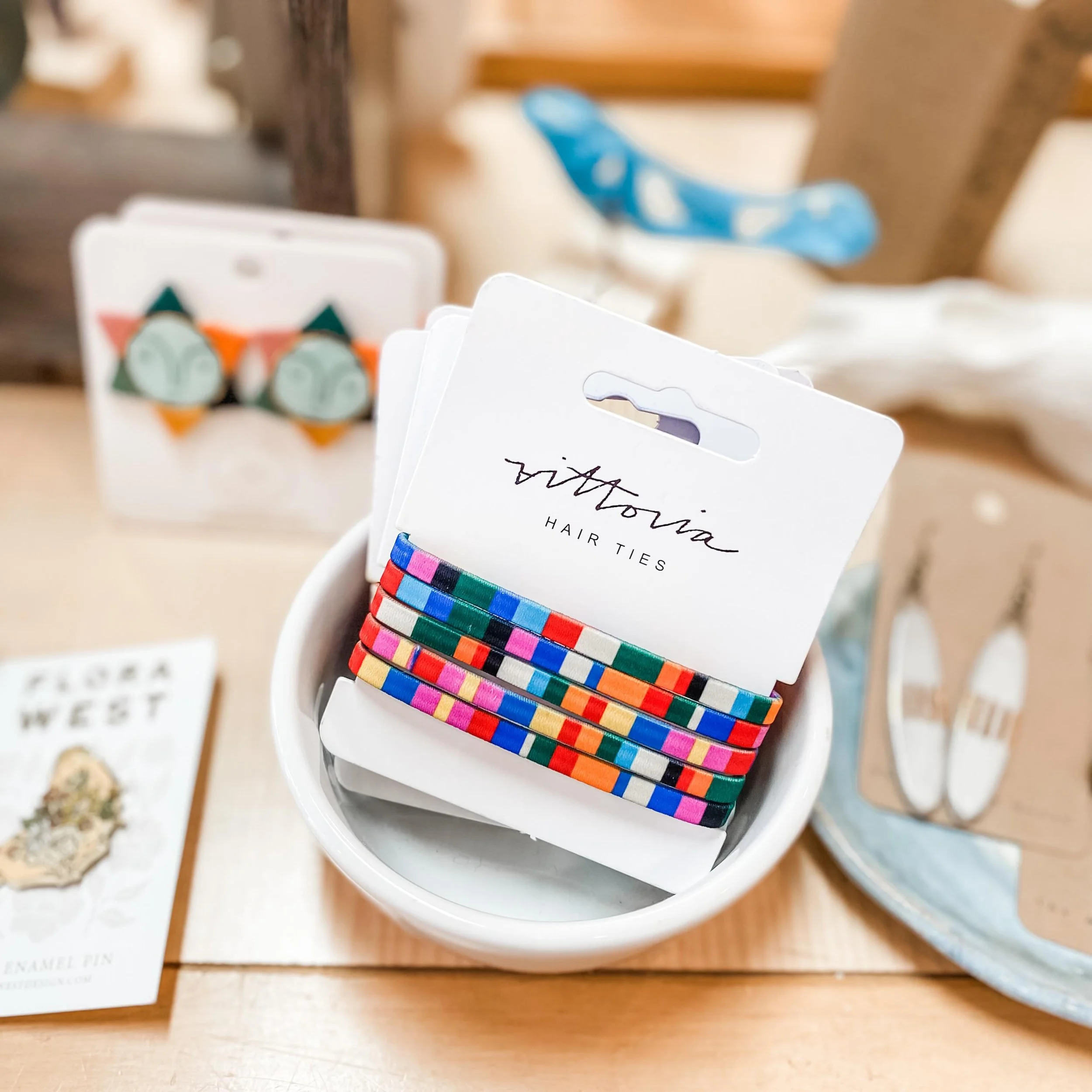 We&rsquo;re always adding new surprises! These colorful hair ties from @amber_vittoria double as bracelets and are perfect for summer! 🌈 What else will you discover in the shop?