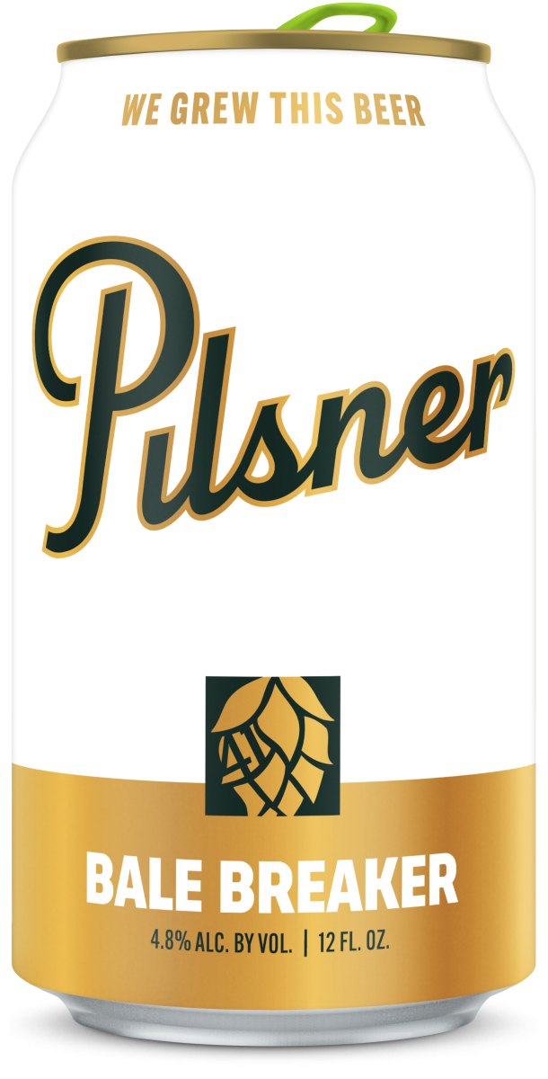 A can of Pulser Bale Breaker beer with a white background, gold accents, and the text 'WE GROWN THIS BEER' at the top, and 'PULSER' in large black and gold script in the center. The center also features a hop cone graphic, and the bottom states 'BALE BREAKER' with 4.8% alcohol content, and 12 fluid ounces.