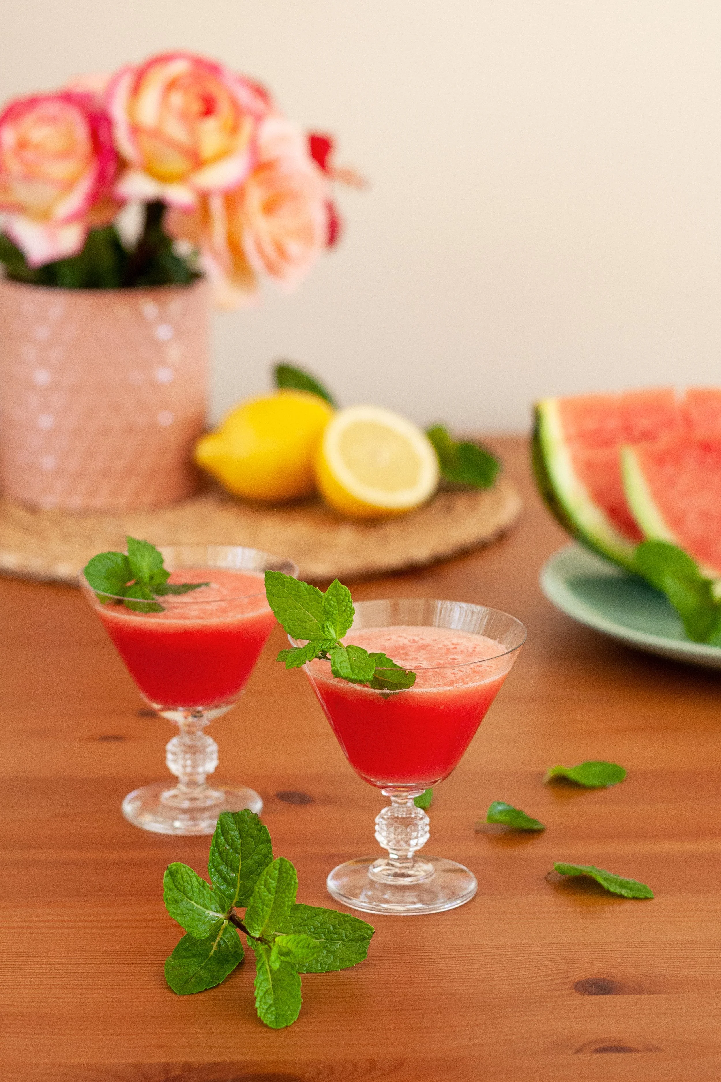 Watermelon cocktail in glass on wood table