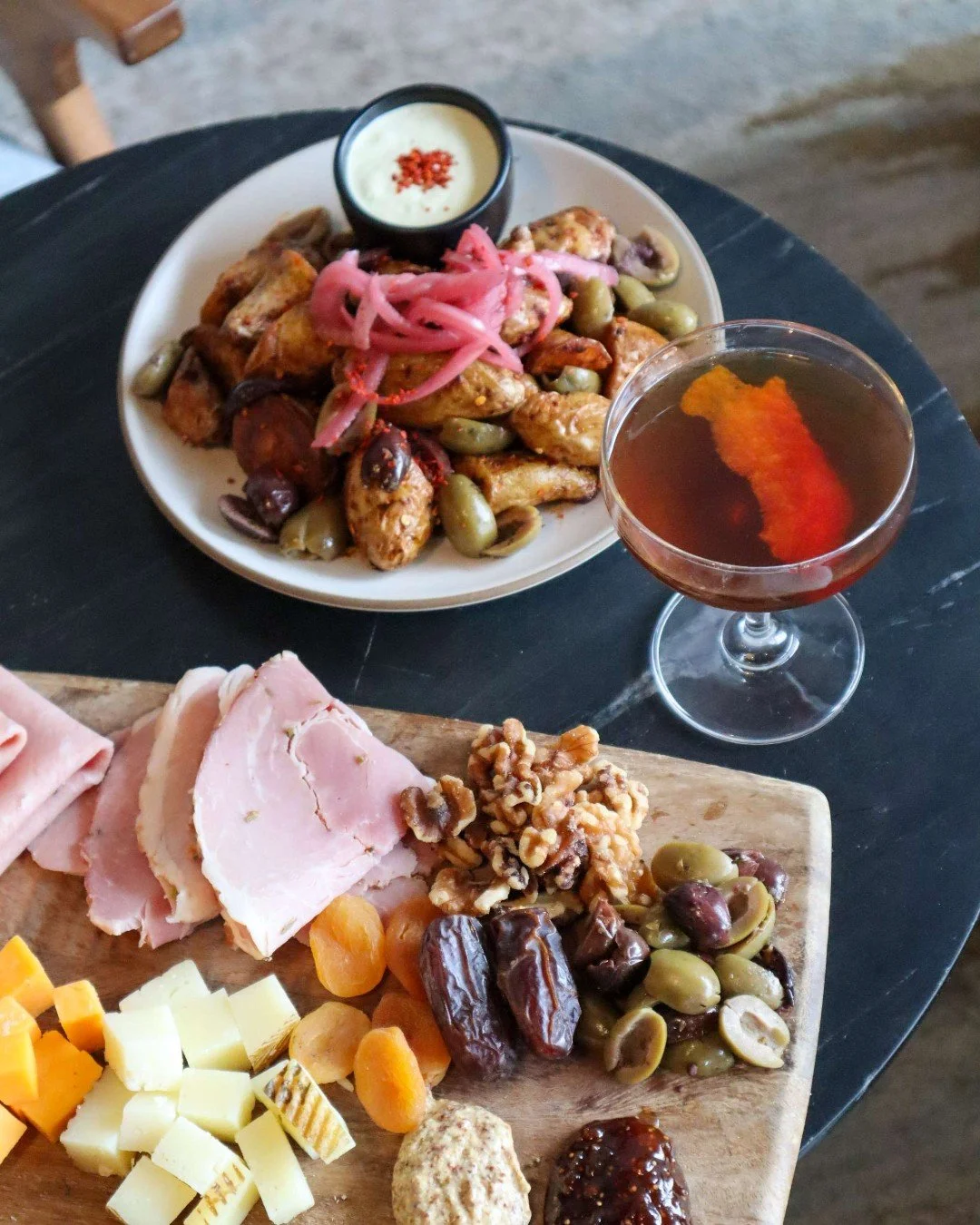 Golden hour plans = handled. 🍸
House cocktails, charcuterie, and shareable bites made for lingering a little longer at the table. Join us for Happy Hour, Tues&ndash;Thurs from 3&ndash;6 PM.