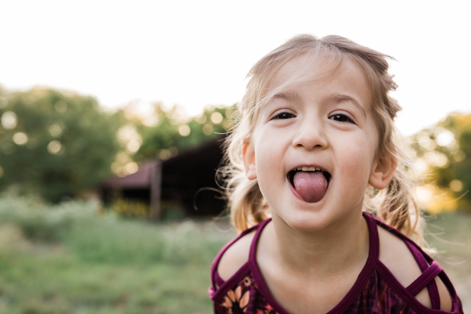 girl sticking her tongue out family photographer