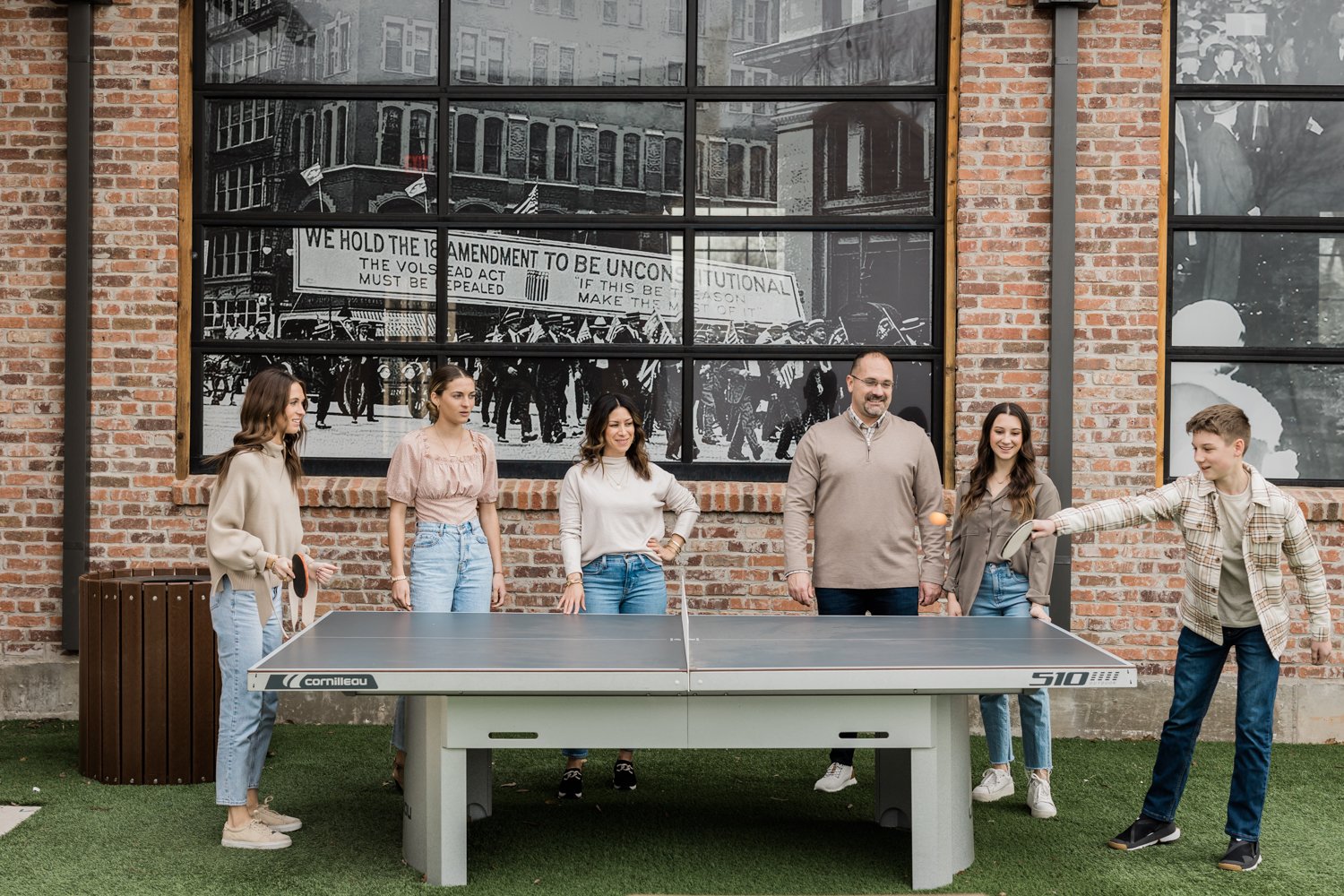 family playing ping pong lifestyle photos