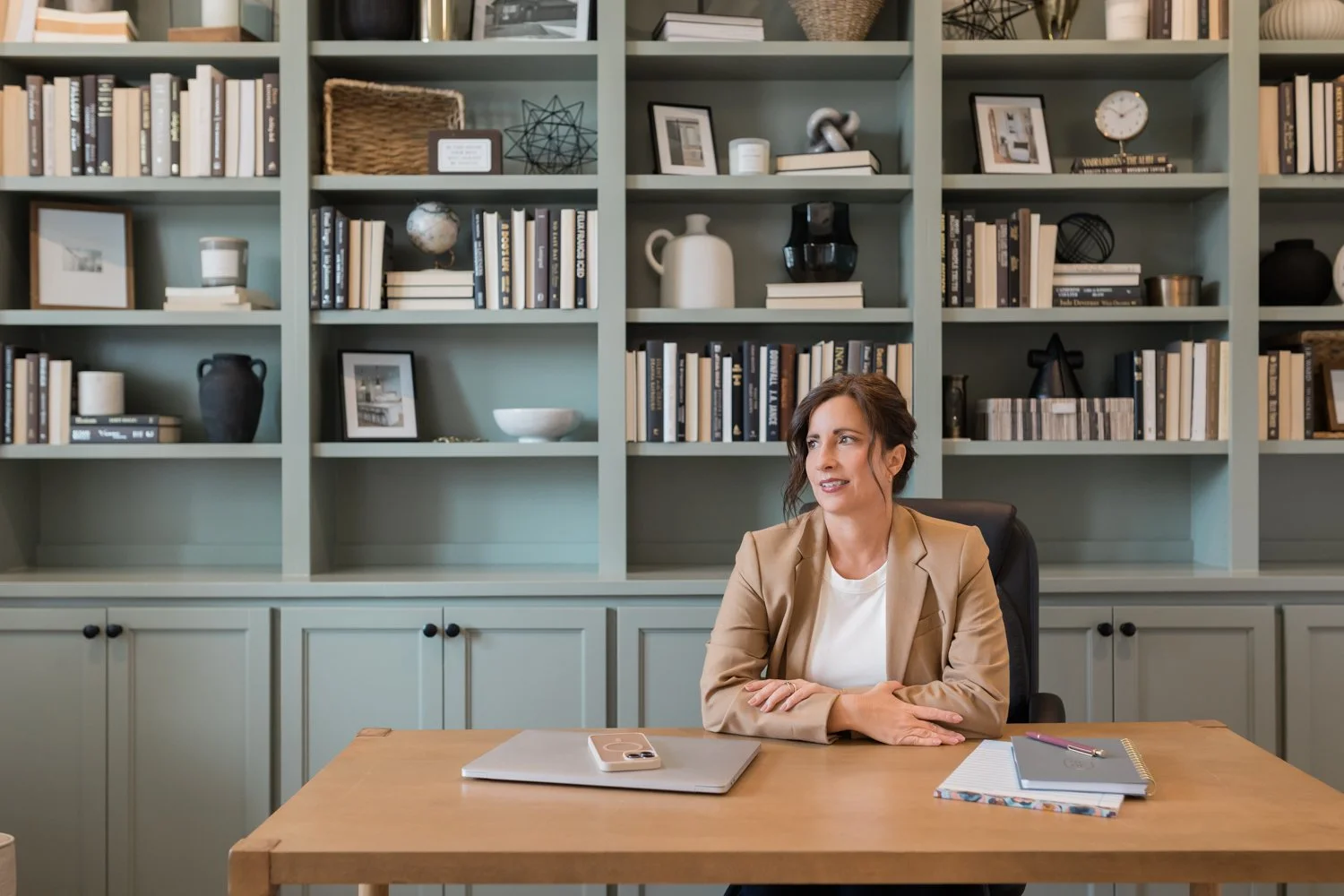 Woman working at home office desk during OKC branding session