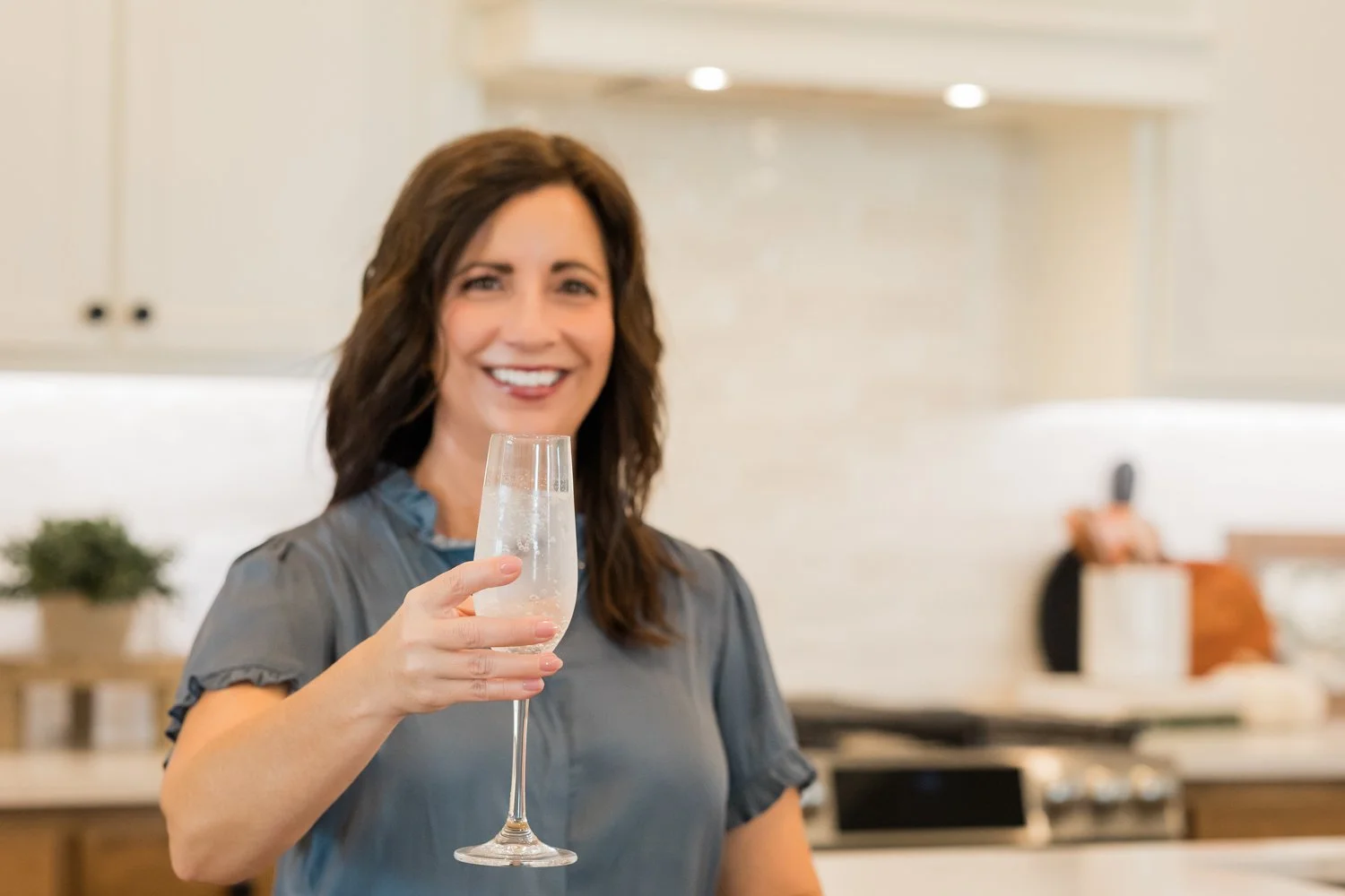 Celebratory brand photo with sparkling drink for closing day content