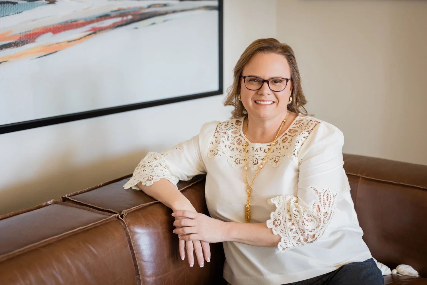 Warm and approachable business owner headshot for a service-based brand