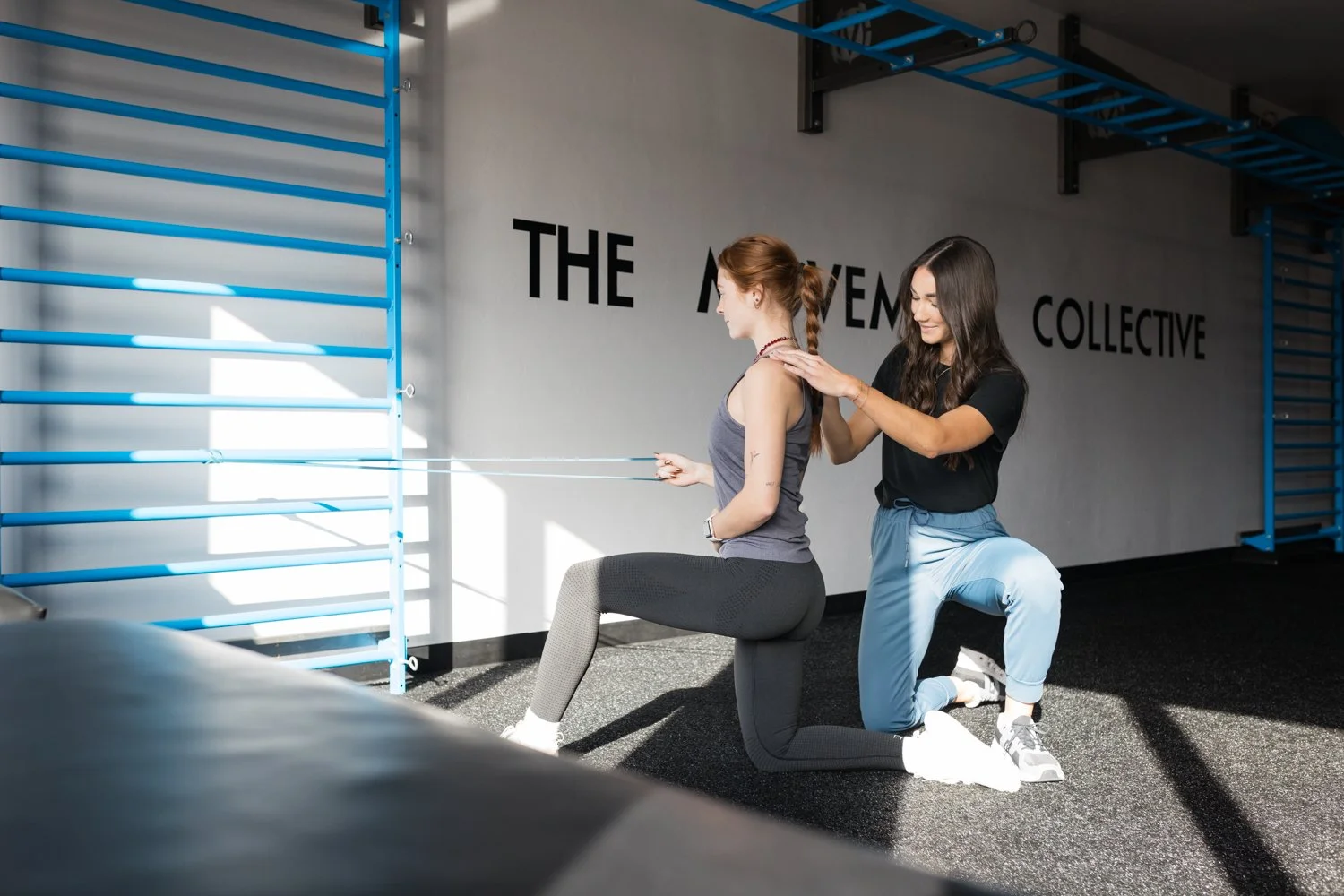 Physical therapist guiding rehab exercise in Oklahoma City clinic with natural brand photography