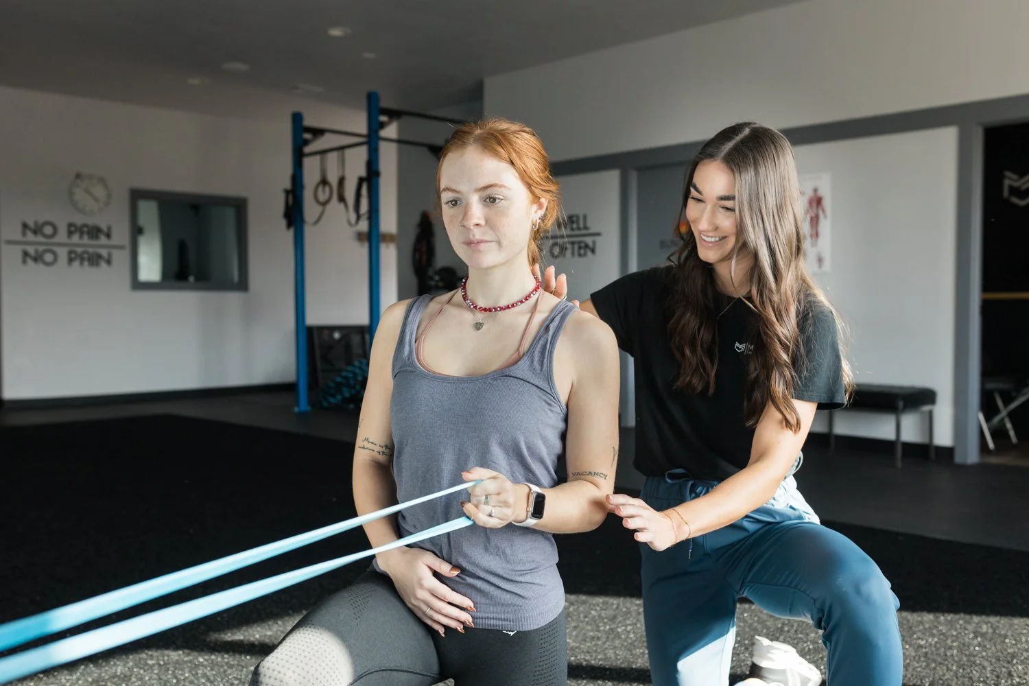 Brand photography of physical therapist demonstrating mobility exercises in Norman, Oklahoma