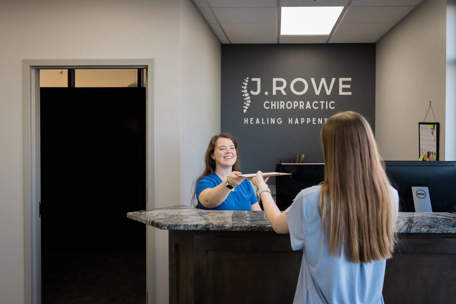 Warm and welcoming chiropractic office interior in OKC photographed for brand storytelling