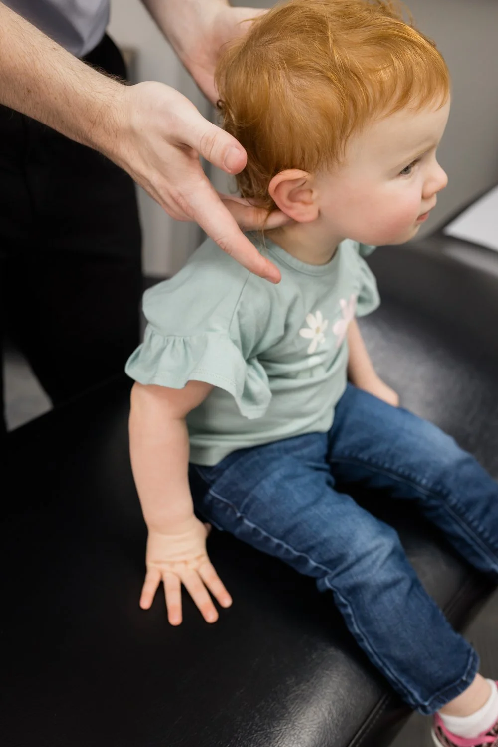 Friendly interaction between physical therapist and patient in Oklahoma clinic