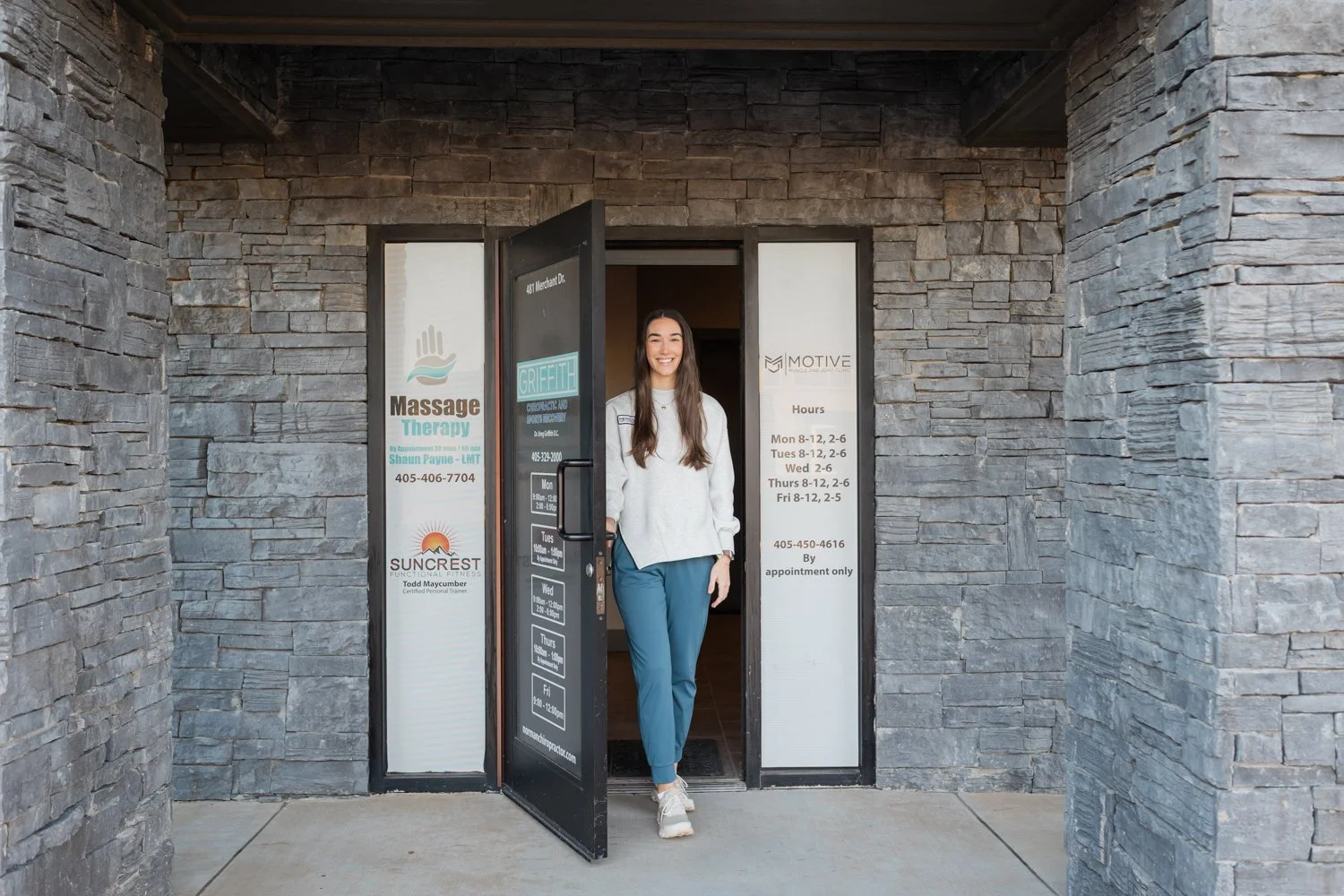 Lifestyle headshot of chiropractor in clinic space in Norman, Oklahoma