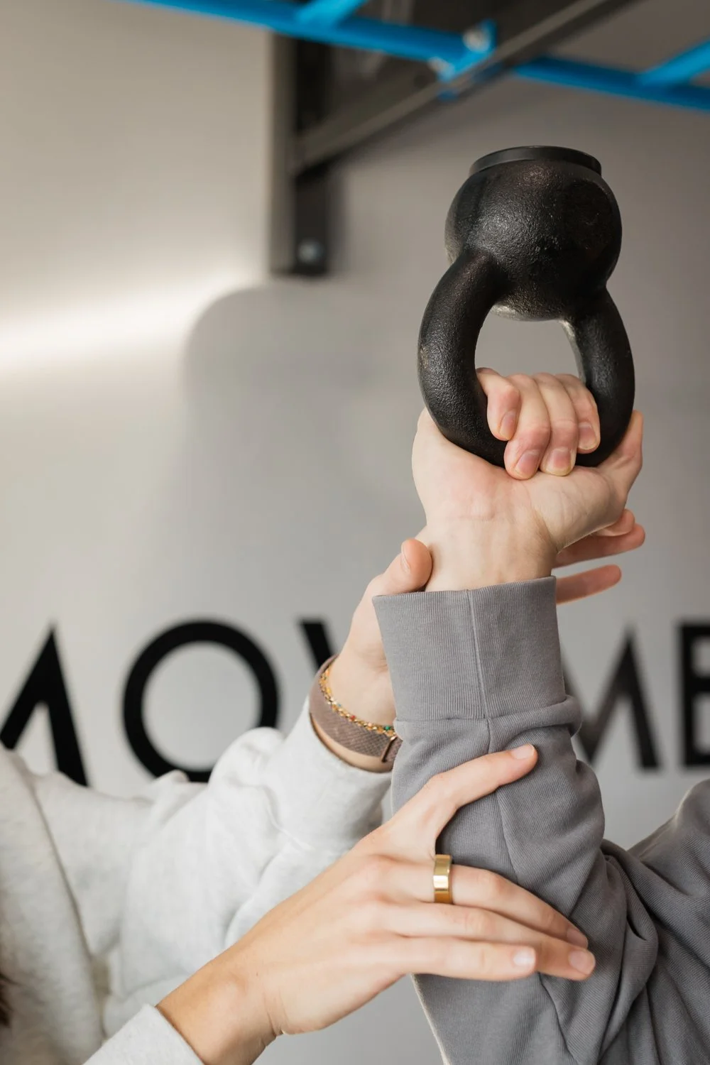 Brand photography of physical therapist demonstrating mobility exercises in Norman, Oklahoma