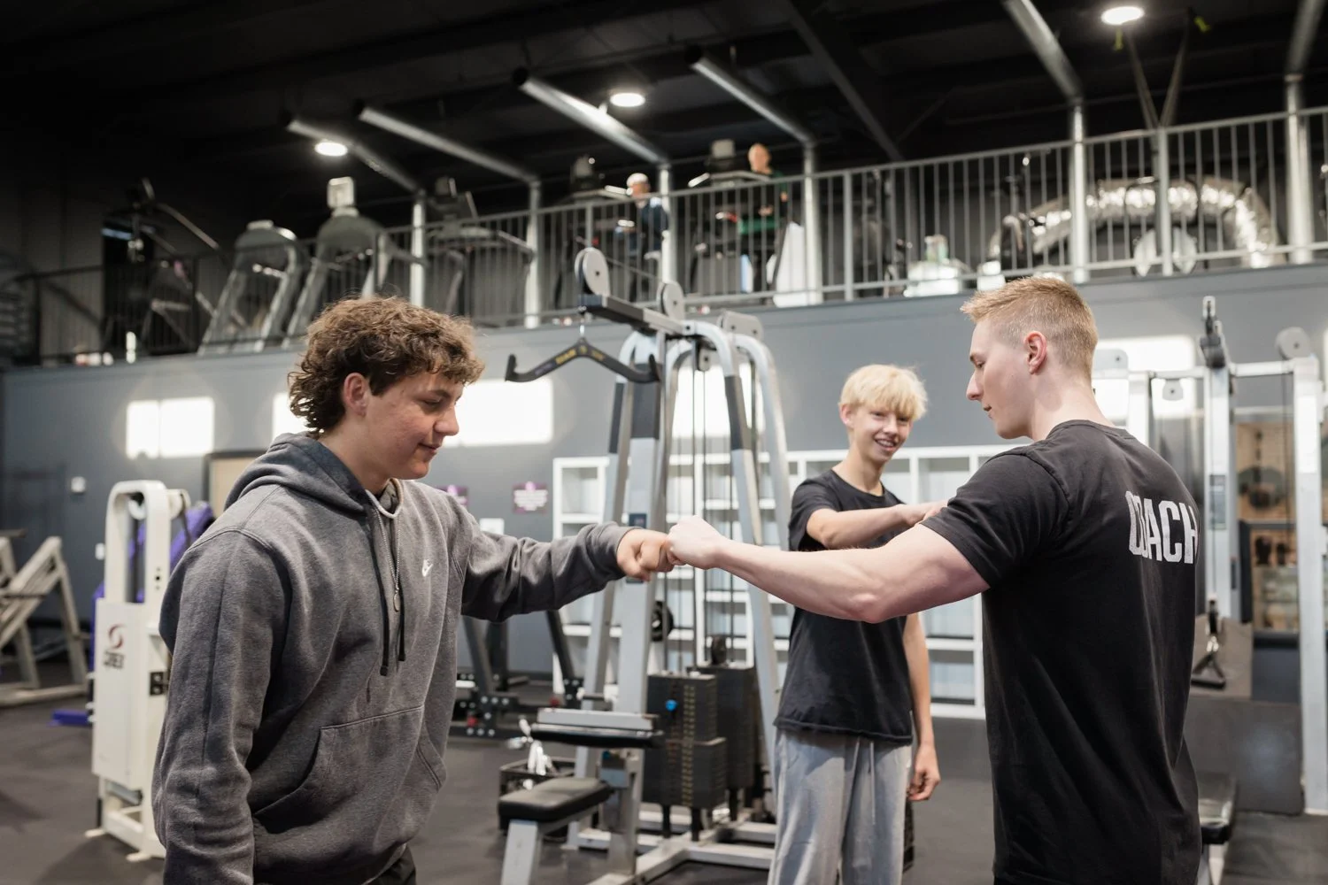 fitness consultation with coach reviewing personalized program