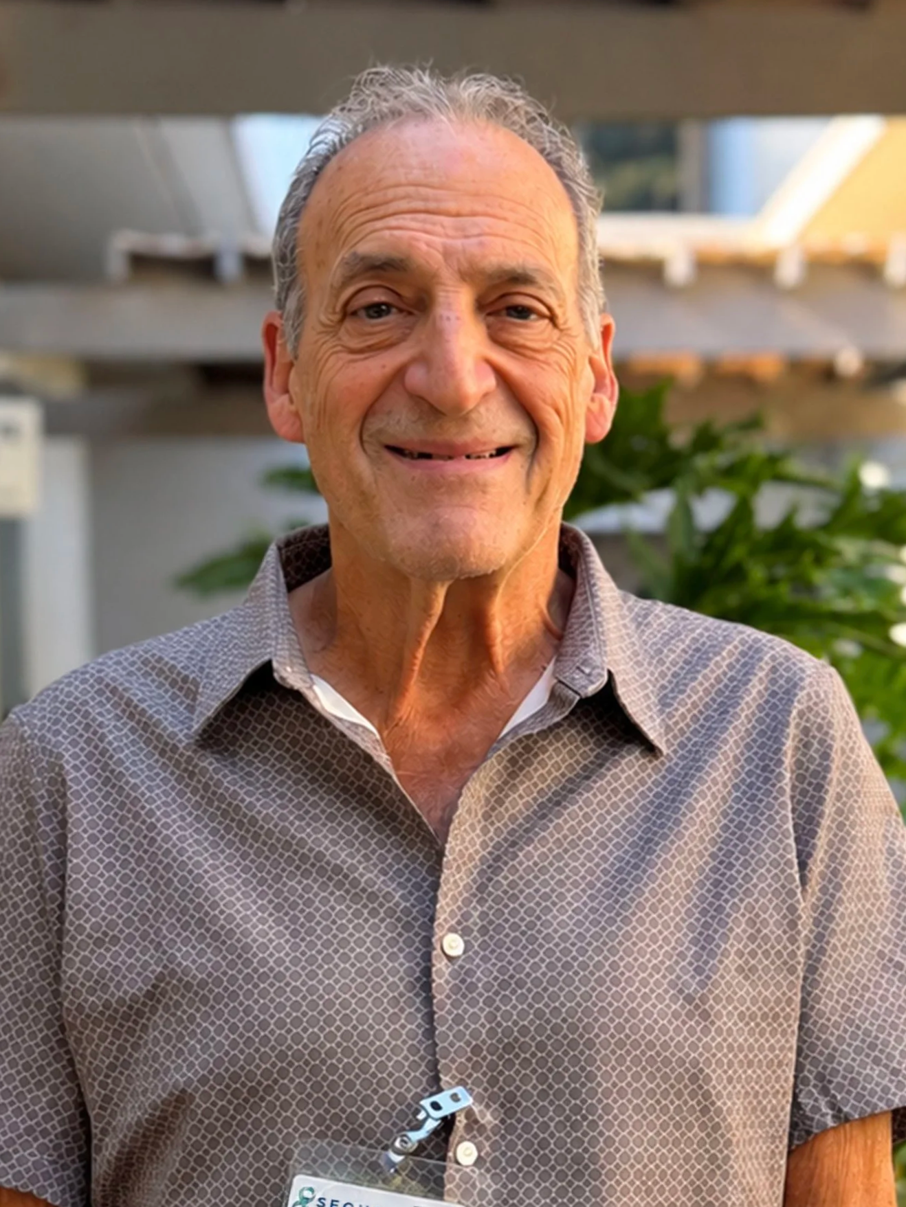 Dr. Charles Taksa smiling outside at Sequoia Family Medical Center.