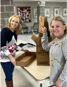 smiling volunteers preparing food supplies