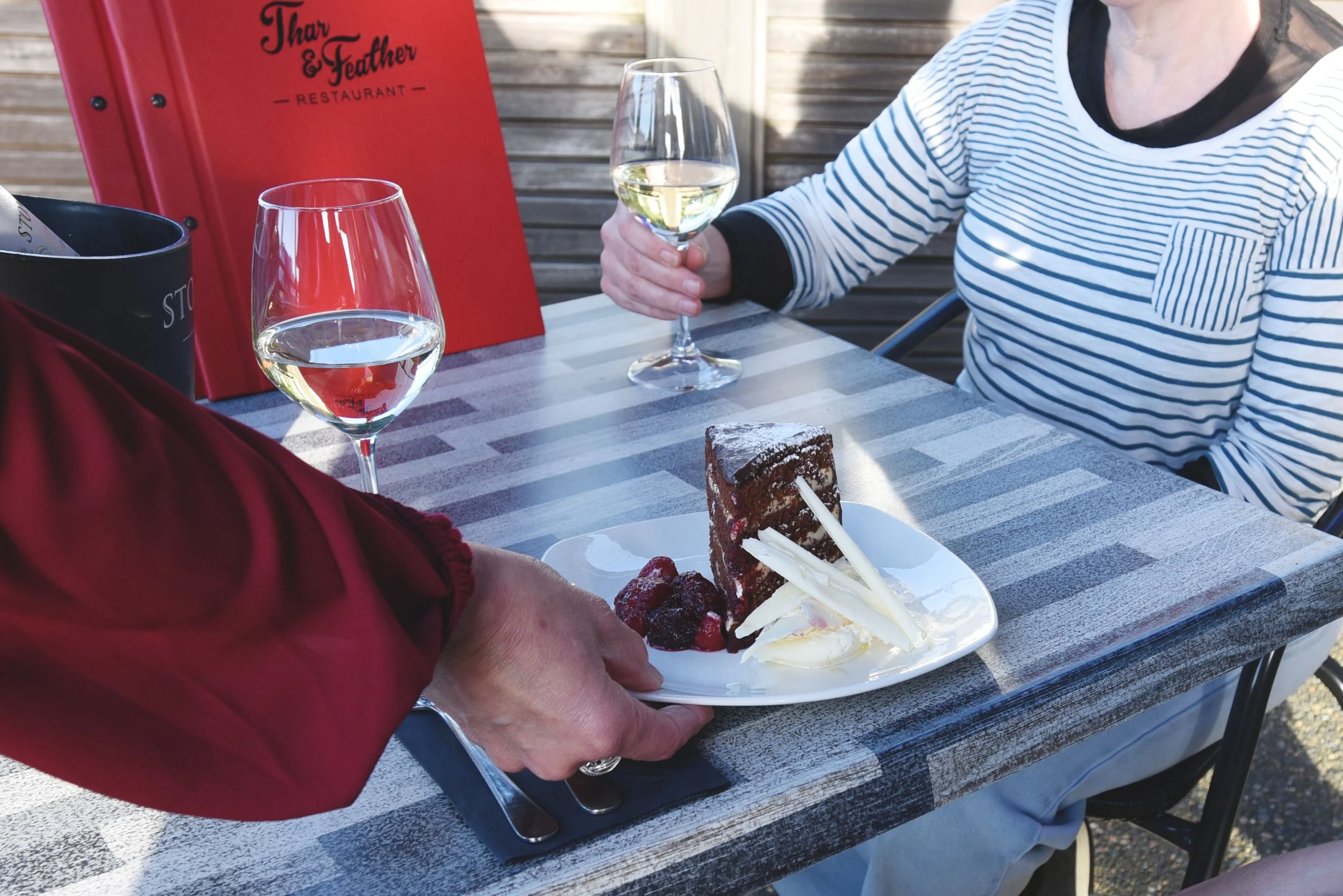 Thar and Feather serving dessert.jpeg