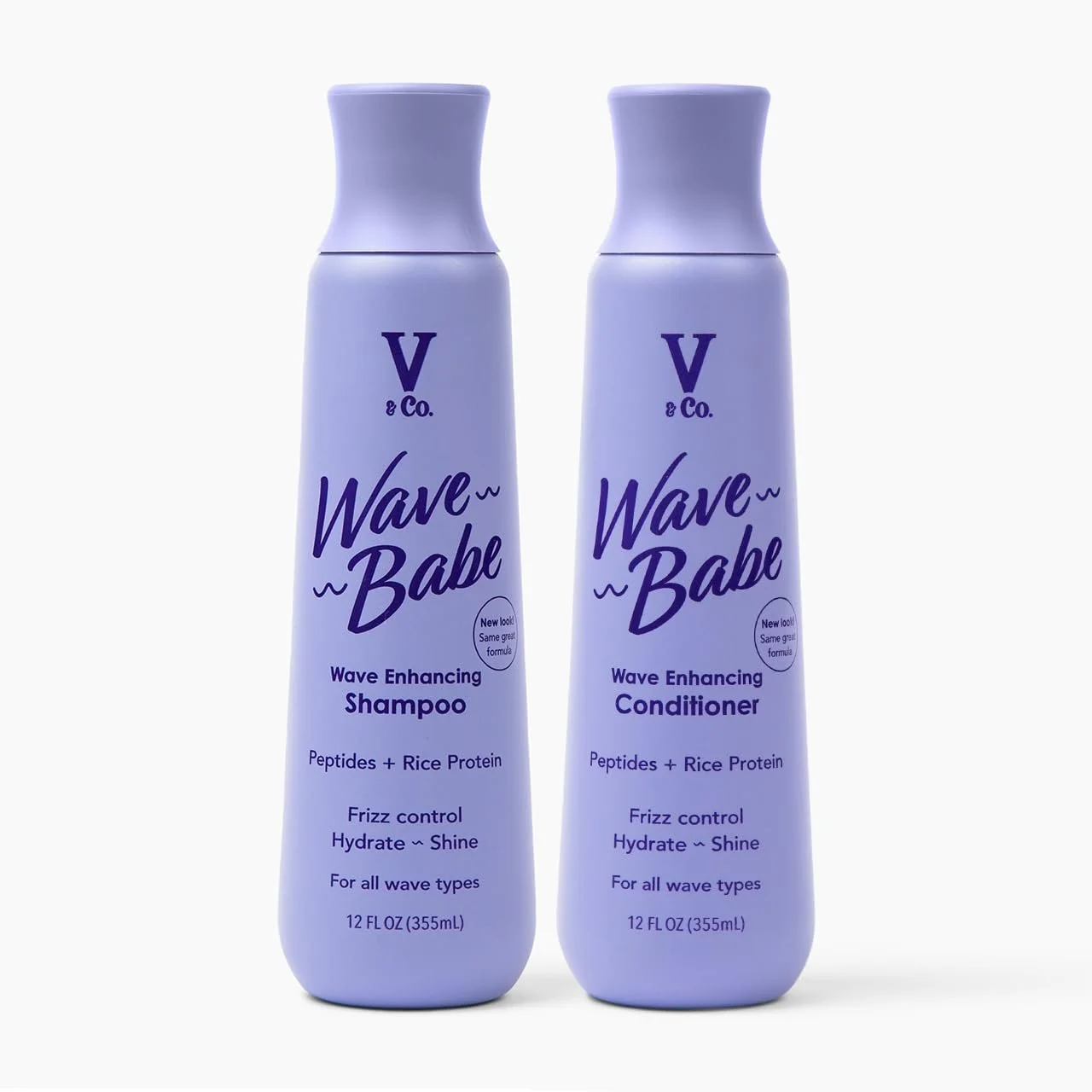 Two bottles of V & Co. Wave Babe hair products, shampoo and conditioner, in light purple bottles with dark purple text, against a light background.
