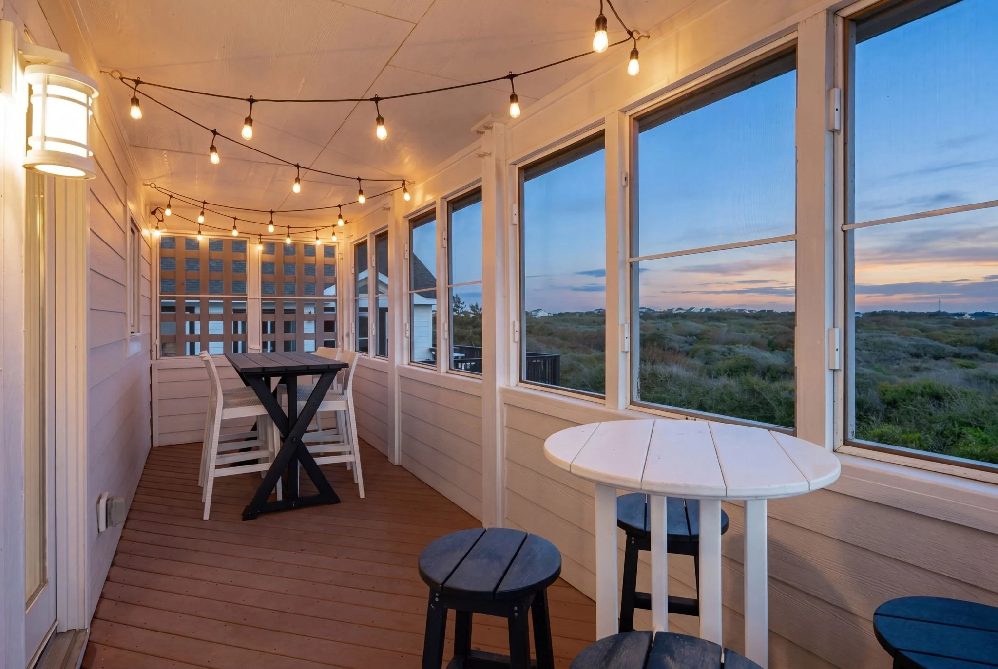 28-web-or-mls-611-Sea-Oats-TL-Screened-Porch-Twilight.jpg