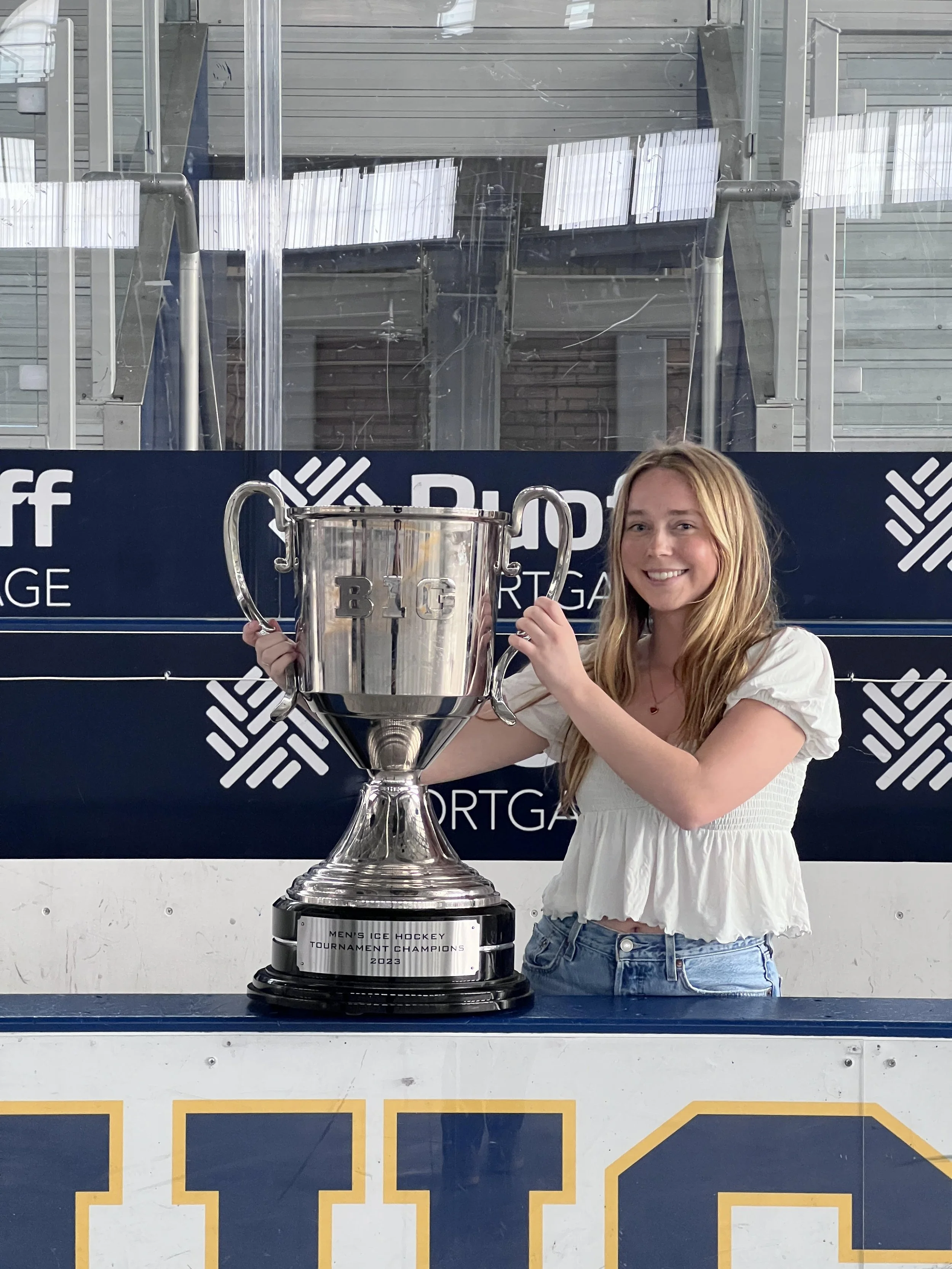 standing w championship trophy